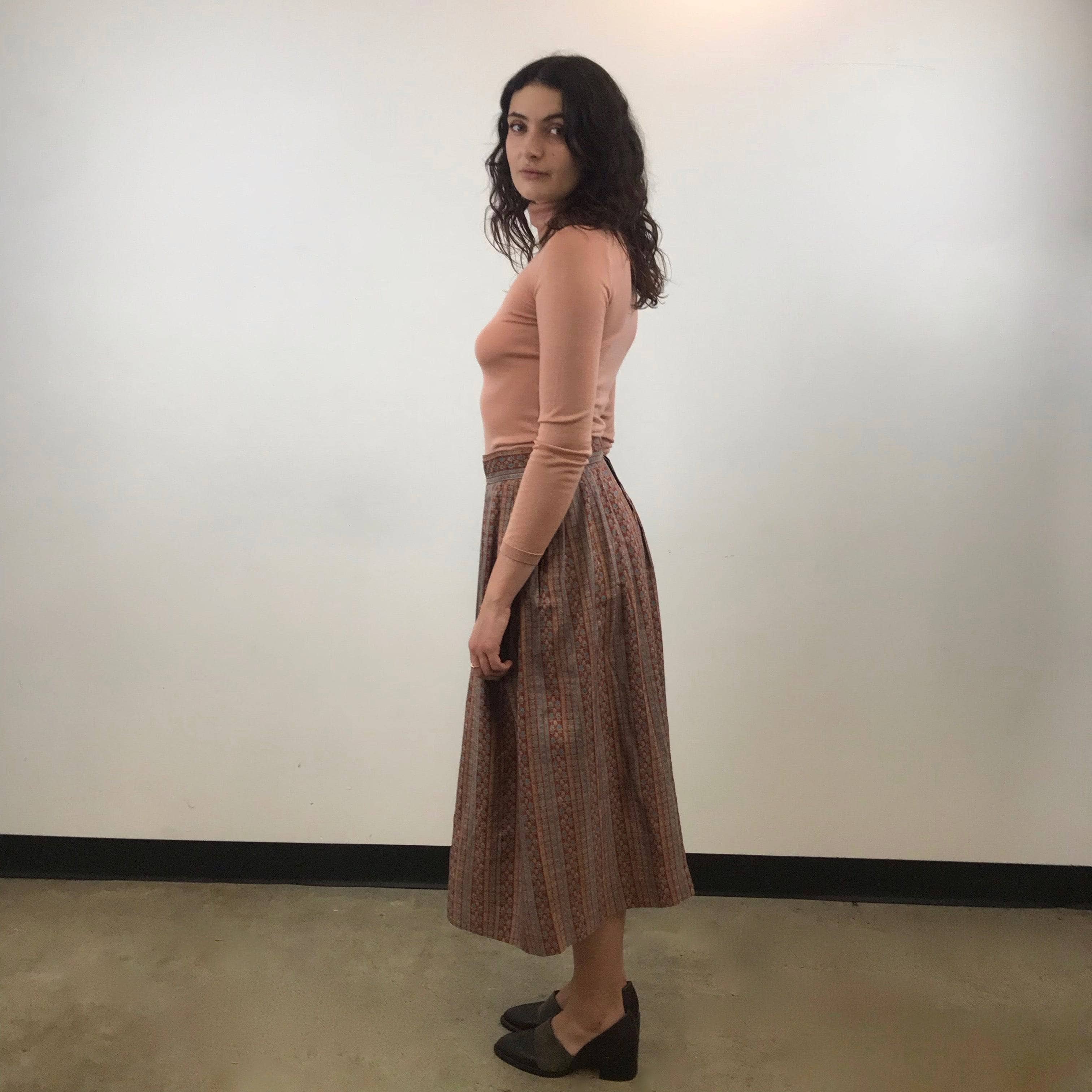 Side view of 1970s Yves Saint Laurent Rive Gauche Pleated Silk Midi Skirt Size Medium sold by bohemevintage.com Montreal