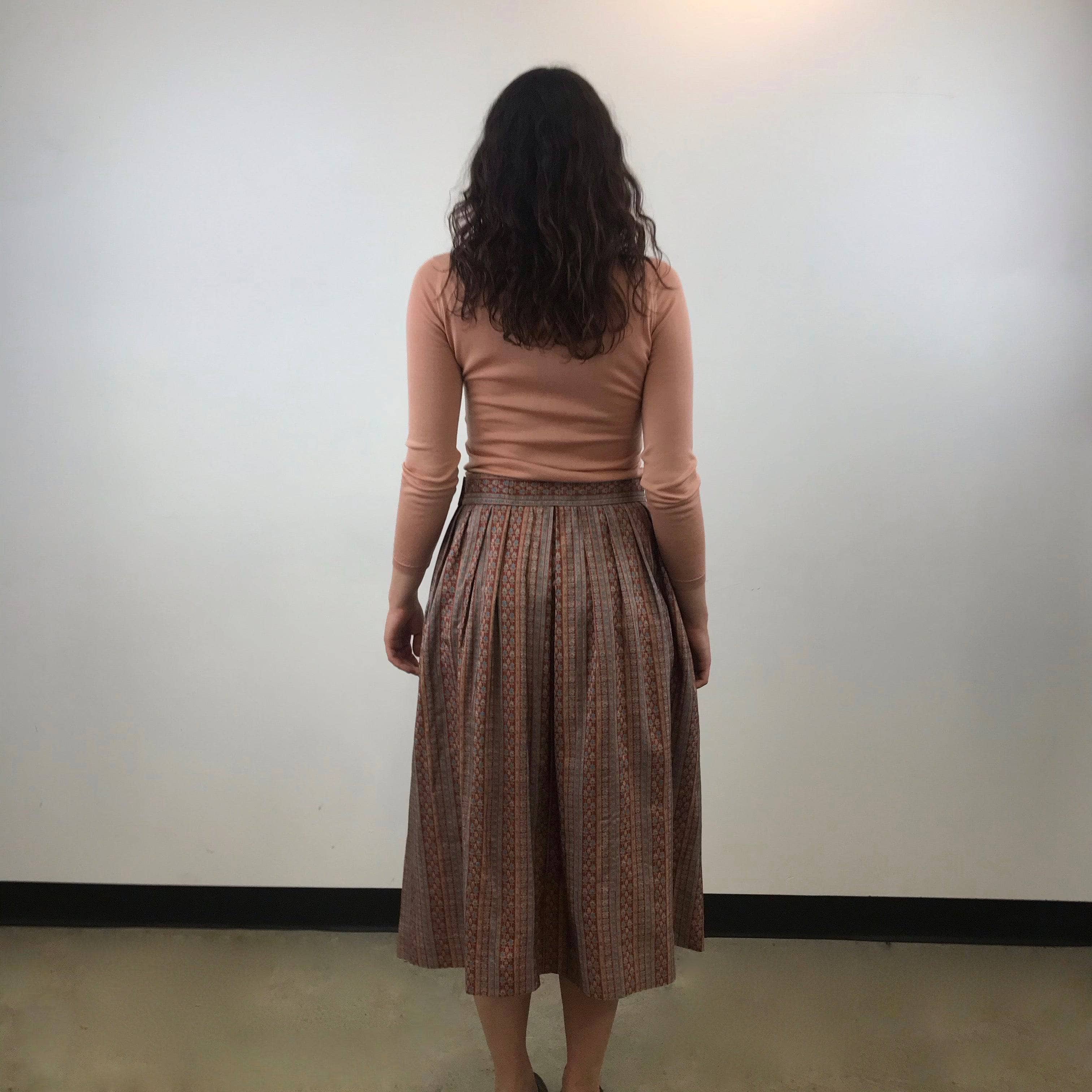 Back view of 1970s Yves Saint Laurent Rive Gauche Pleated Silk Midi Skirt Size Medium sold by bohemevintage.com Montreal