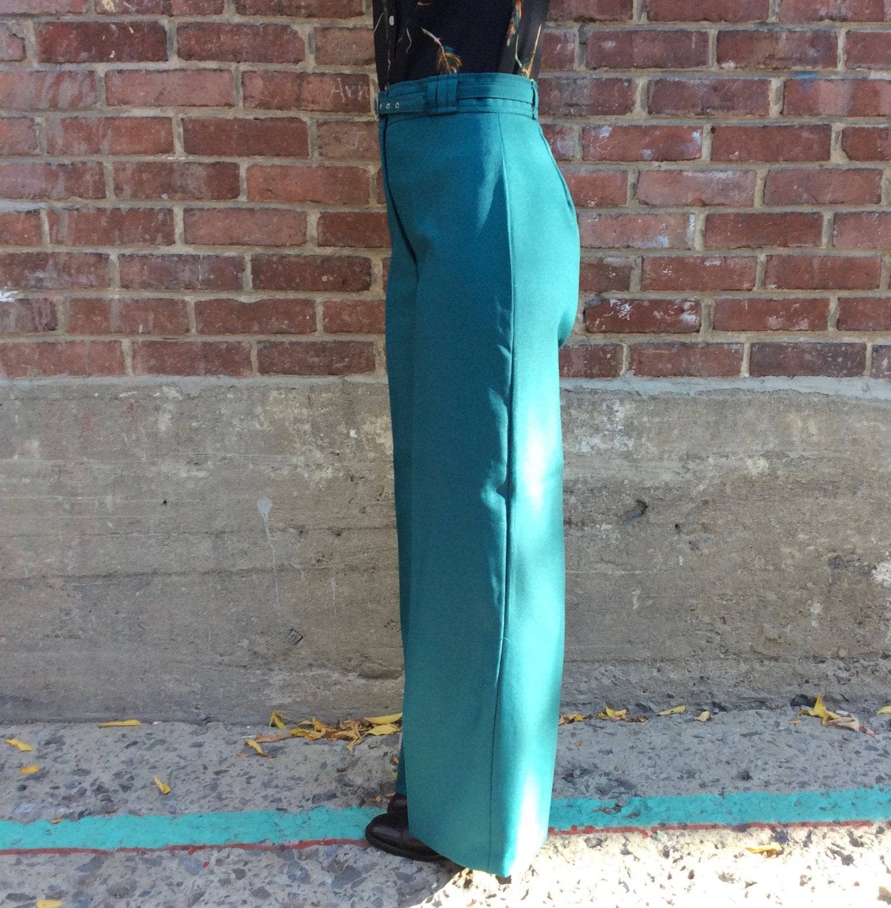 Side view of 1970s Teal High Waisted Wide Leg Pants size Medium sold by bohemevintage.com Montreal