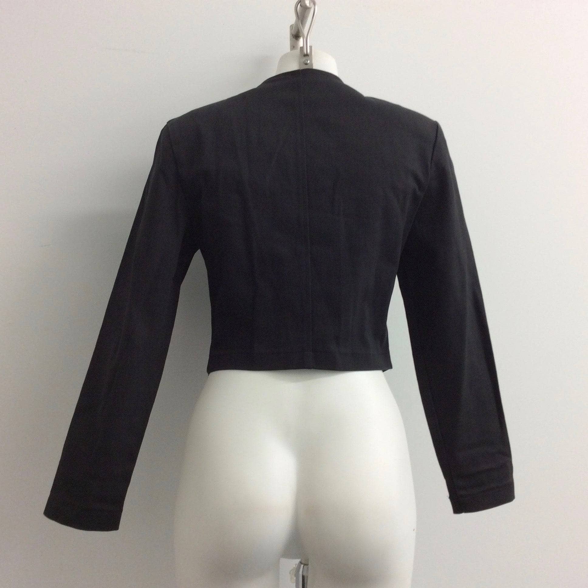 Back View of 1980-90s Black Denim Crop Jacket with Metal Zipper, sold by bohemevintage.com Montréal
