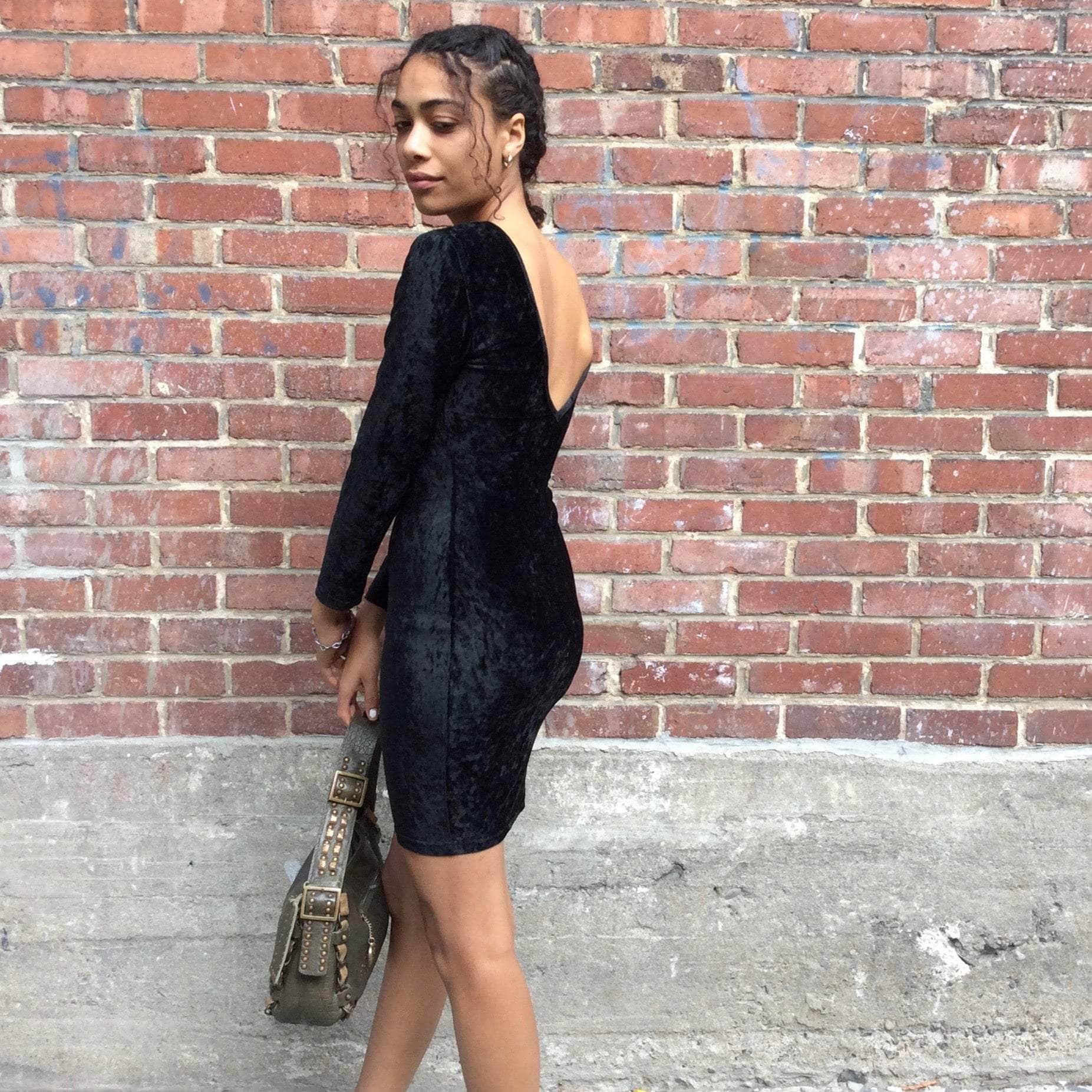 Side Back View of 1990s Open Back Black Velvet Bodycon Mini Dress Size Small sold at bohemevintage.com Montreal