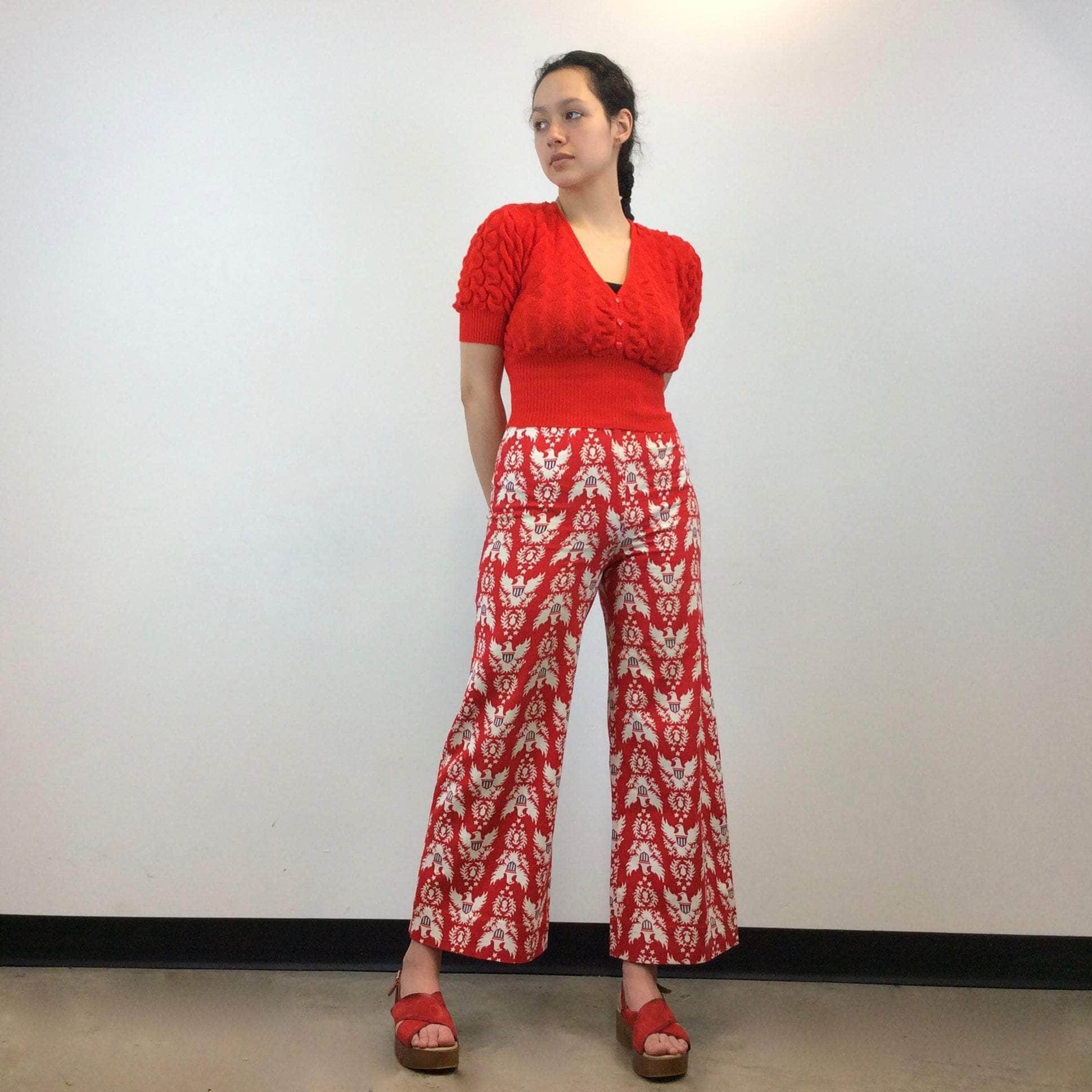 1970s Handmade High-Waist Wide Leg eagle print pants size small-medium worn with red t-shirt and red plateforme sandals sold by Boheme Vintage Montreal