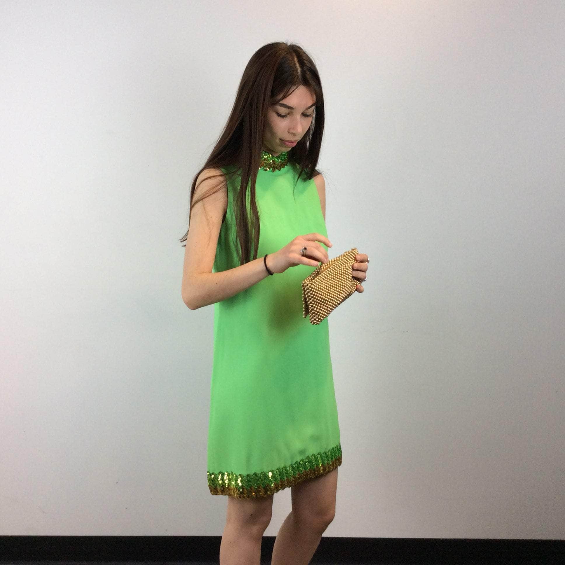 Front and side view of 1960s Lime Green Petite Shift Mini Dress Size Small/Medium sold at bohemevintage.com Montreal