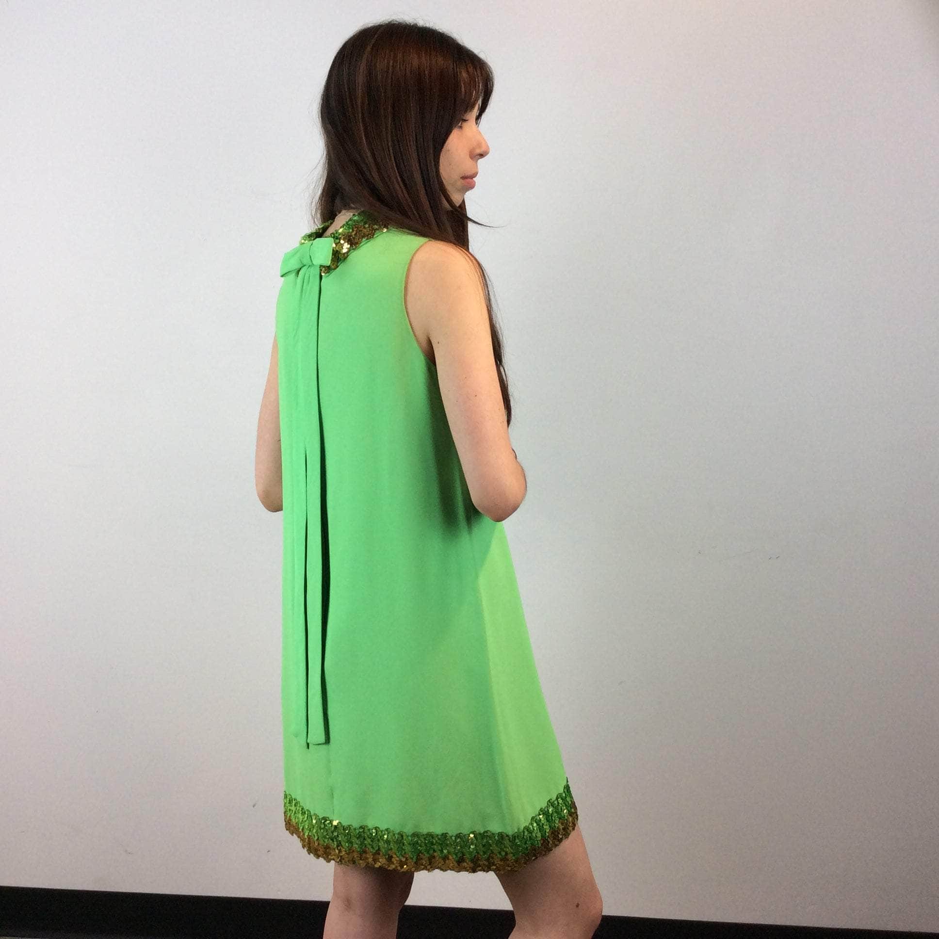 Back and side view of 1960s Lime Green Petite Shift Mini Dress Size Small/Medium sold at bohemevintage.com Montreal