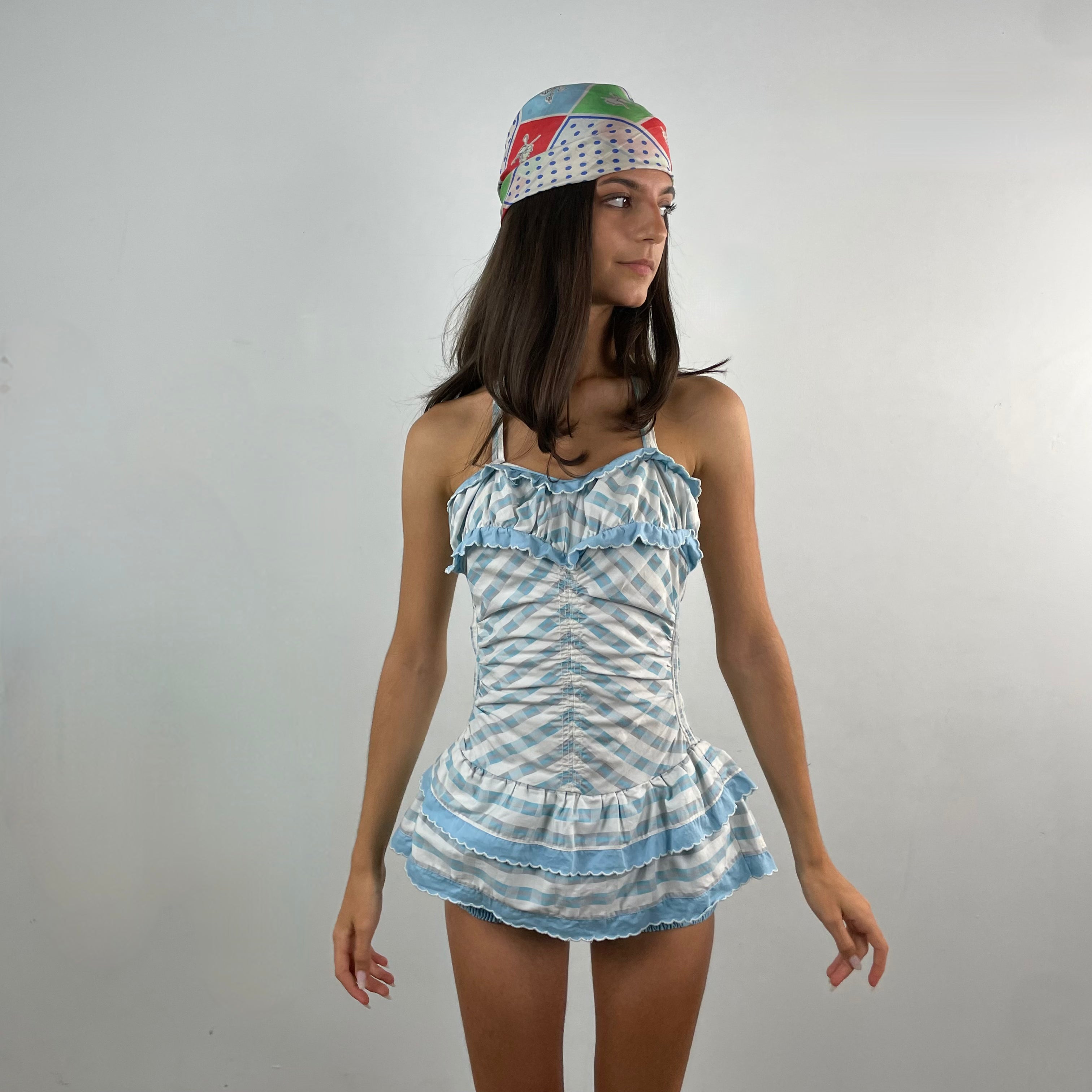 Boheme Vintage 1950s–1960s Sea Nymph Glamour Suit by Milbro cotton one-piece bathing suit with halter neckline, ruffled skirt, and built-in shorts.