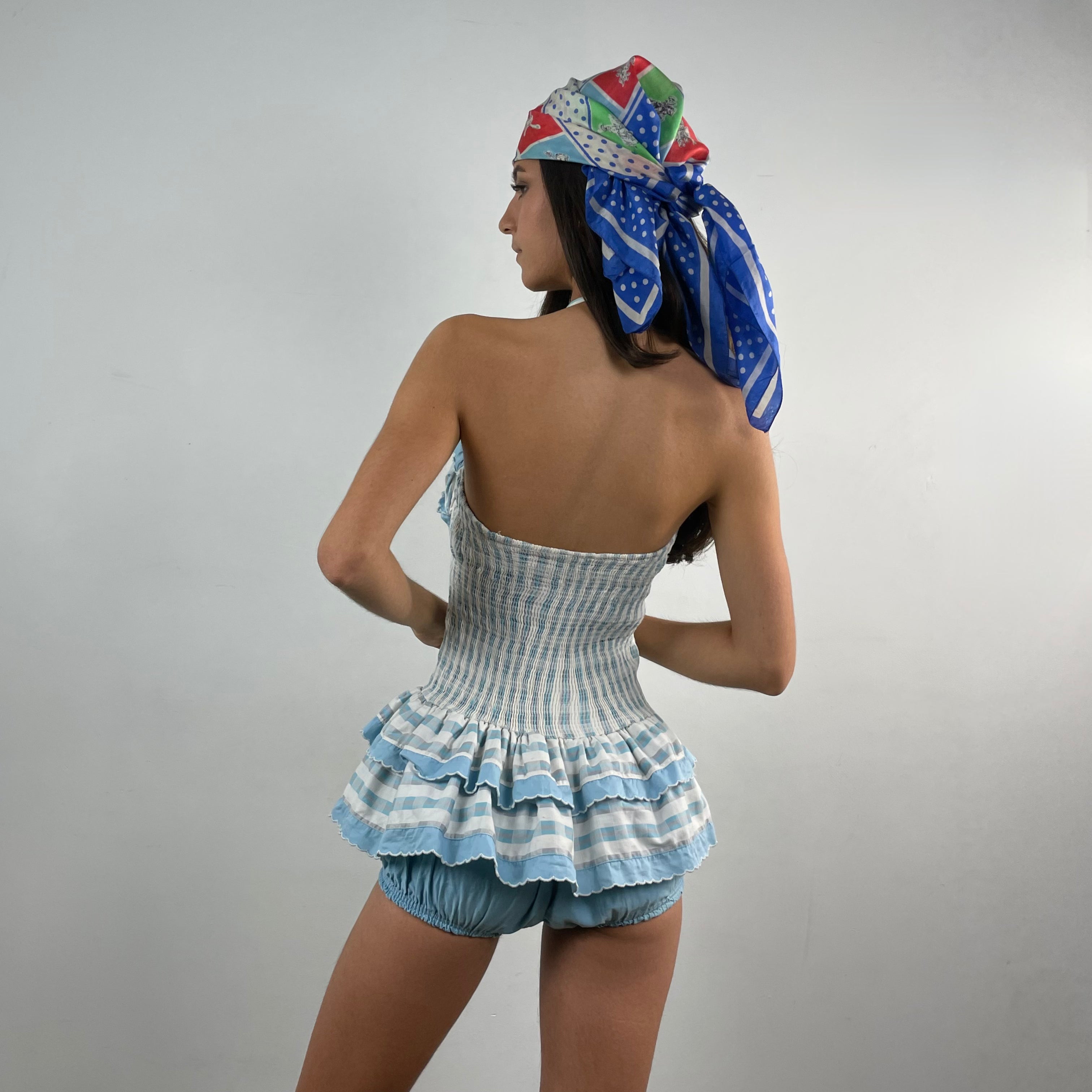 Boheme Vintage 1950s–1960s Sea Nymph Glamour Suit by Milbro cotton one-piece bathing suit with halter neckline, ruffled skirt, and built-in shorts.