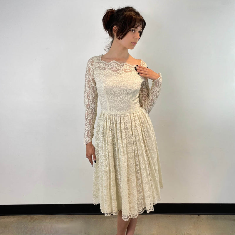 Front view of 1950s Ivory Long Sleeve Lace Dress size Extra-Small/Small sold at bohemevintage.com Montreal