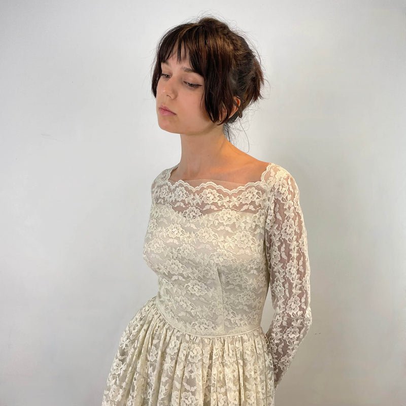  Front view of 1950s Ivory Long Sleeve Lace Dress size Extra-Small/Small sold at bohemevintage.com Montreal