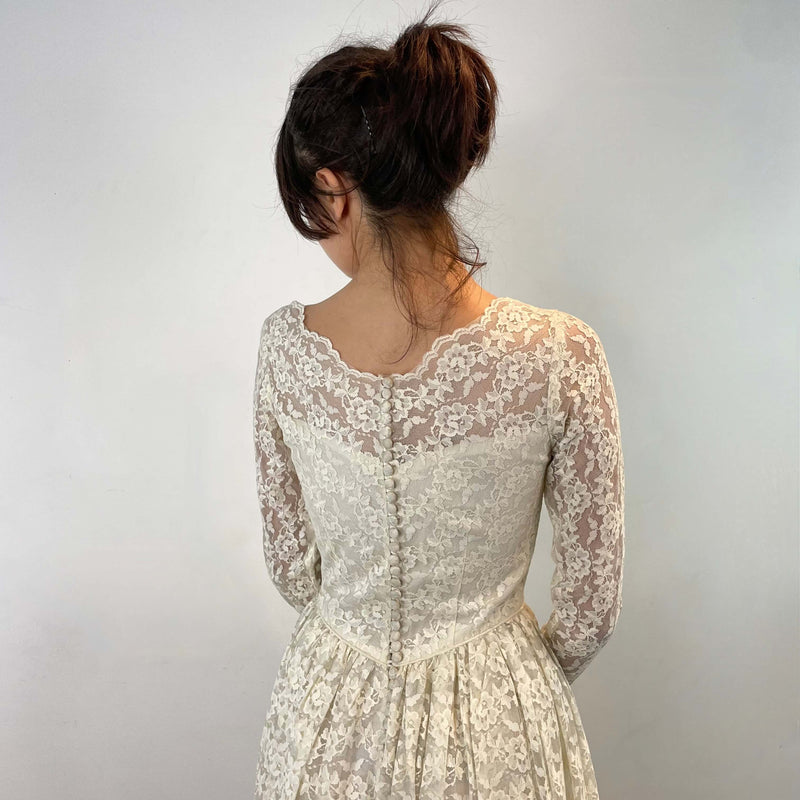 Back view of bodice of 1950s Ivory Long Sleeve Lace Dress size Extra-Small/Small sold at bohemevintage.com Montreal