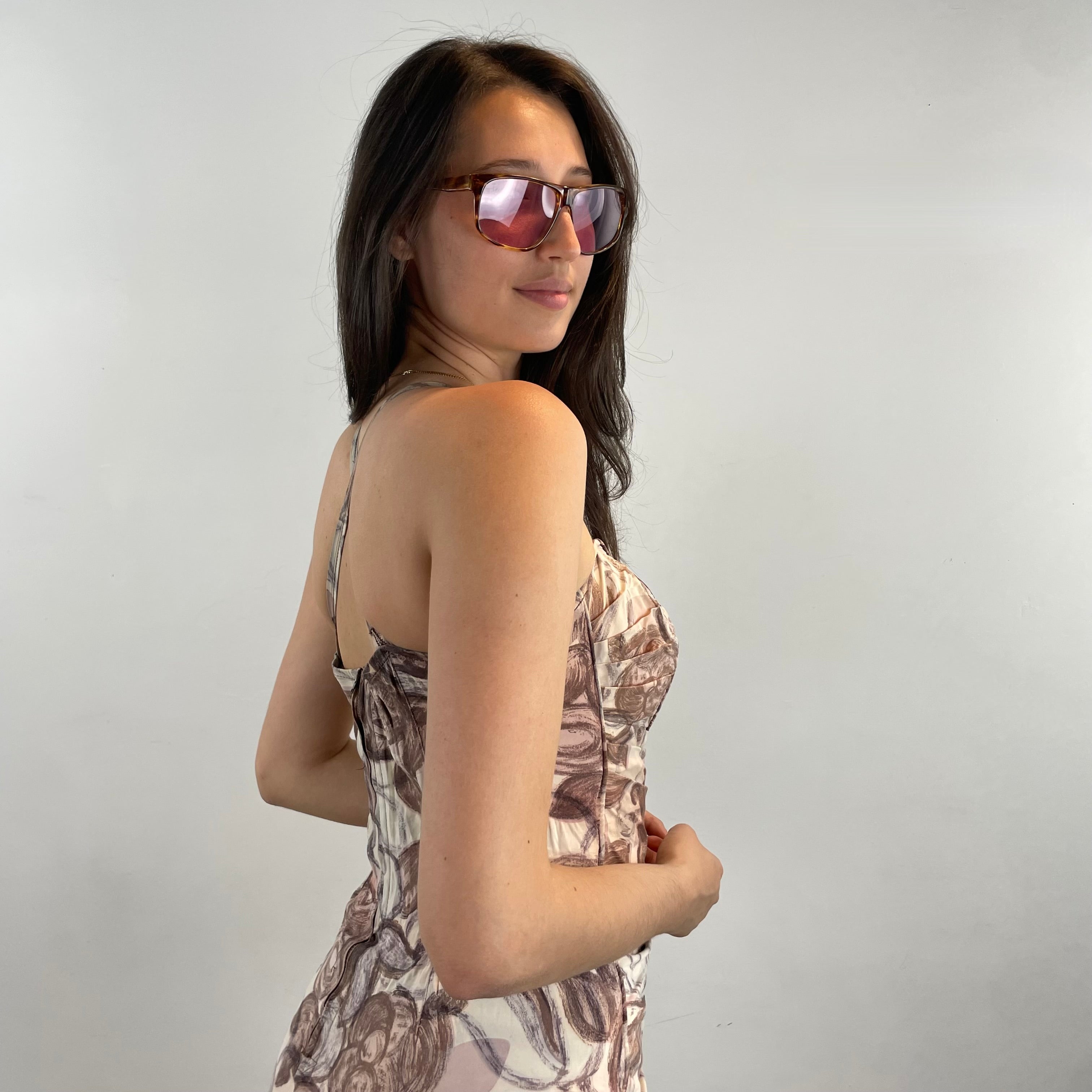 Boheme Vintage 1950s floral ruched one-piece bathing suit with sweetheart neckline, adjustable straps, and skirted silhouette.