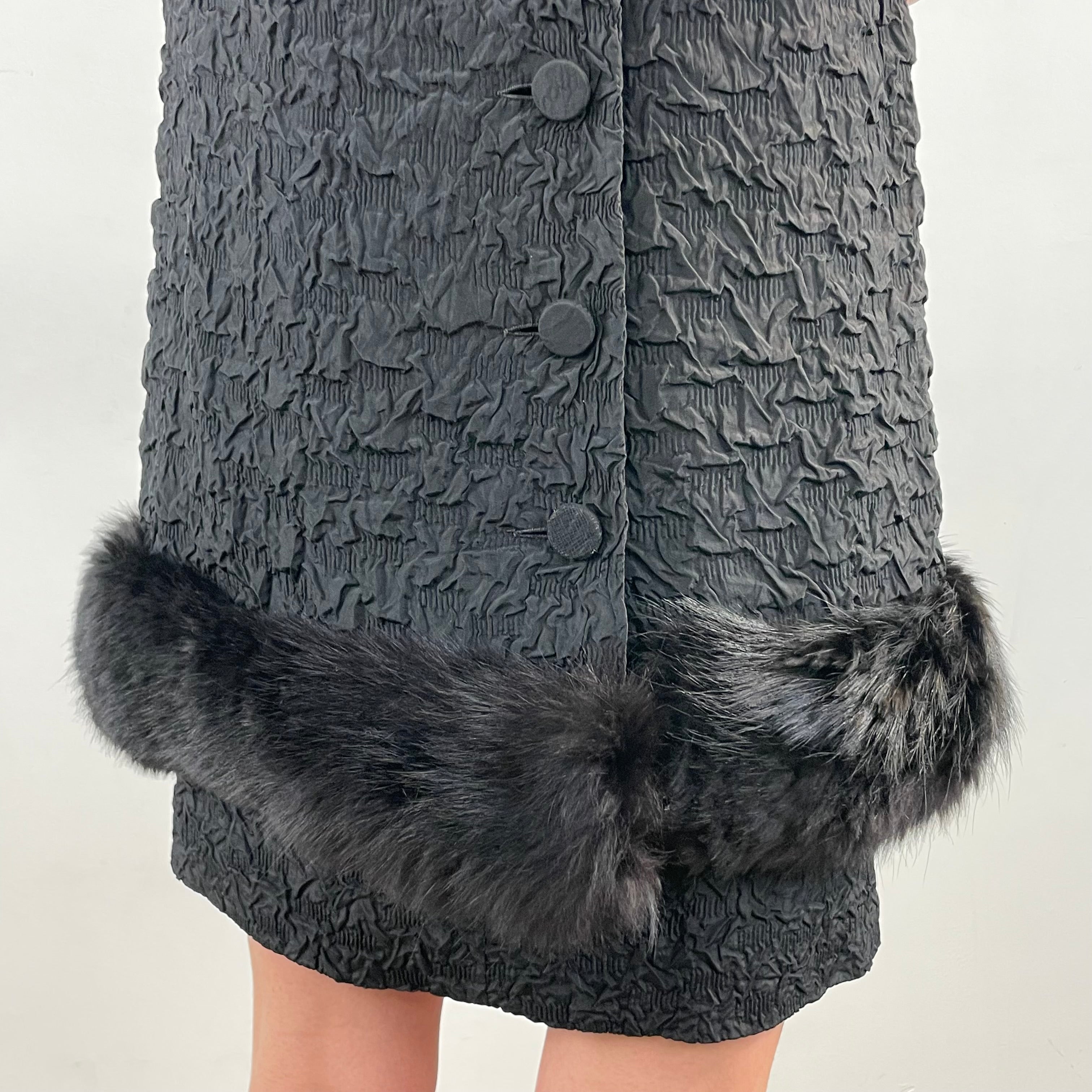 Close up of fur trim and buttoned back opening of 1960s Sleeveless Black Shift Dress with Fur Trim Size Small sold at bohemevintage.com Montreal