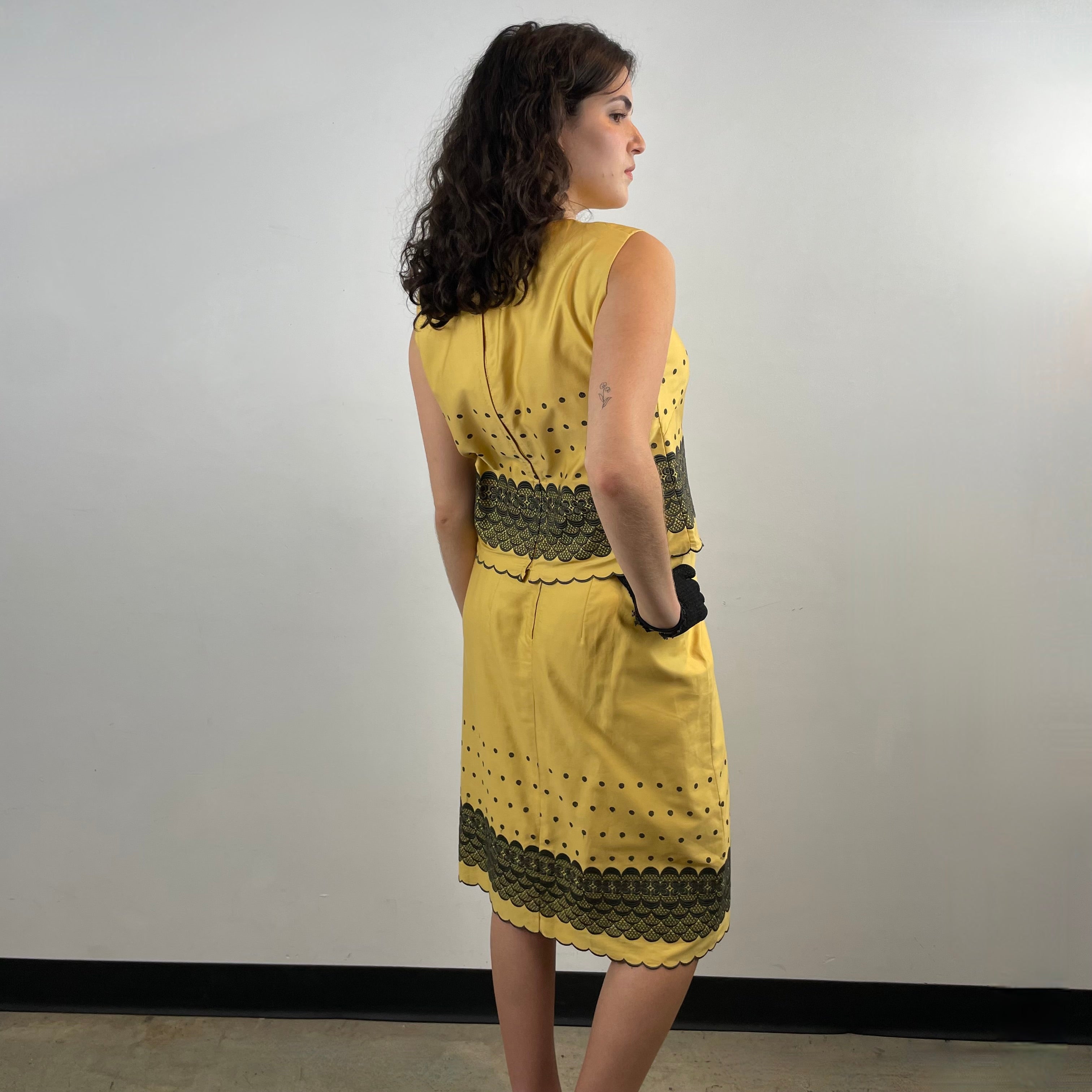 Boheme Vintage 1960s handmade black and gold embroidered cotton skirt and top set with sleeveless top, straight skirt, and scalloped embroidered hems.