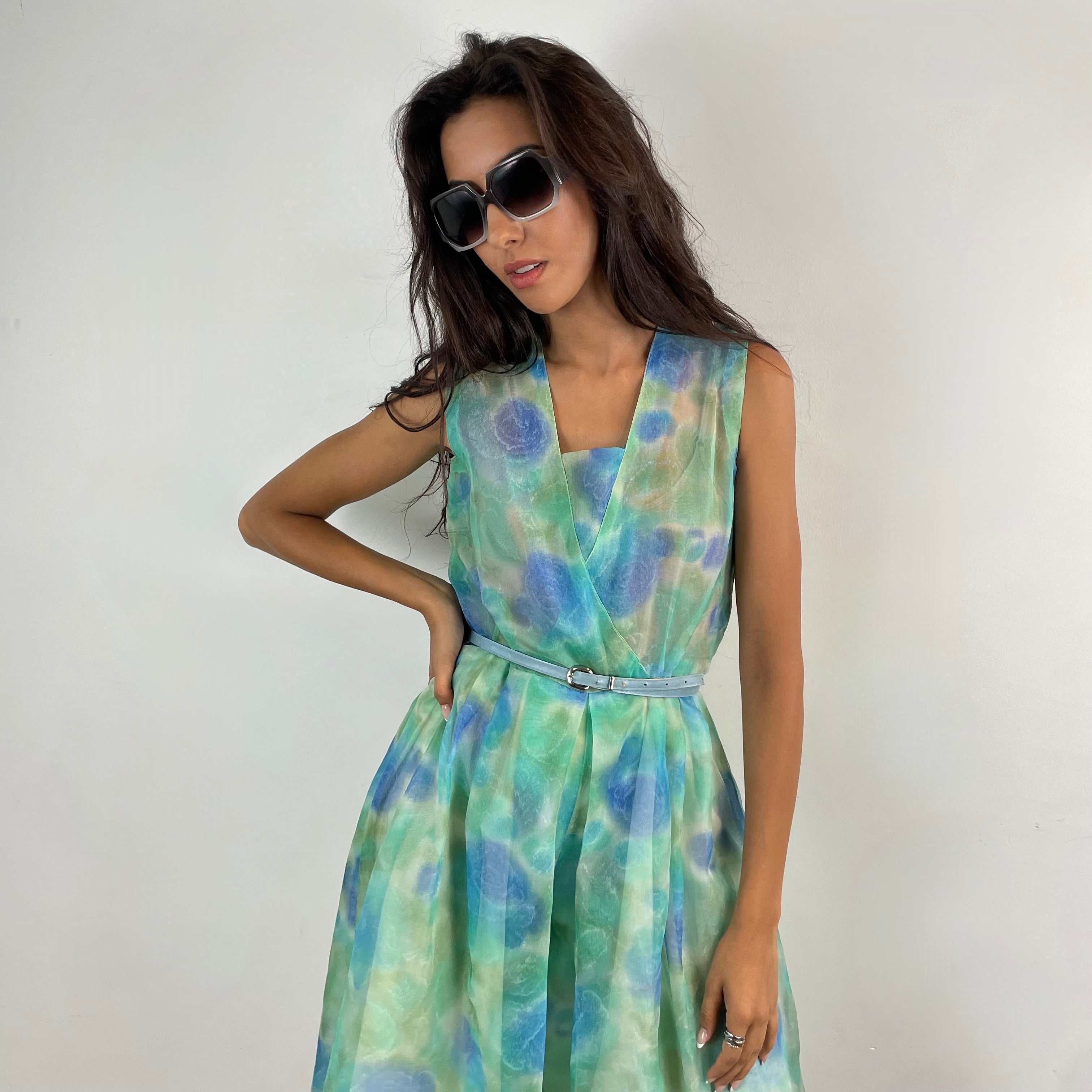 Close Up Front View of Boheme Vintage 1960s handmade floral culotte dress with sheer organza fabric, pleated wide-leg culottes, and cache-coeur neckline.