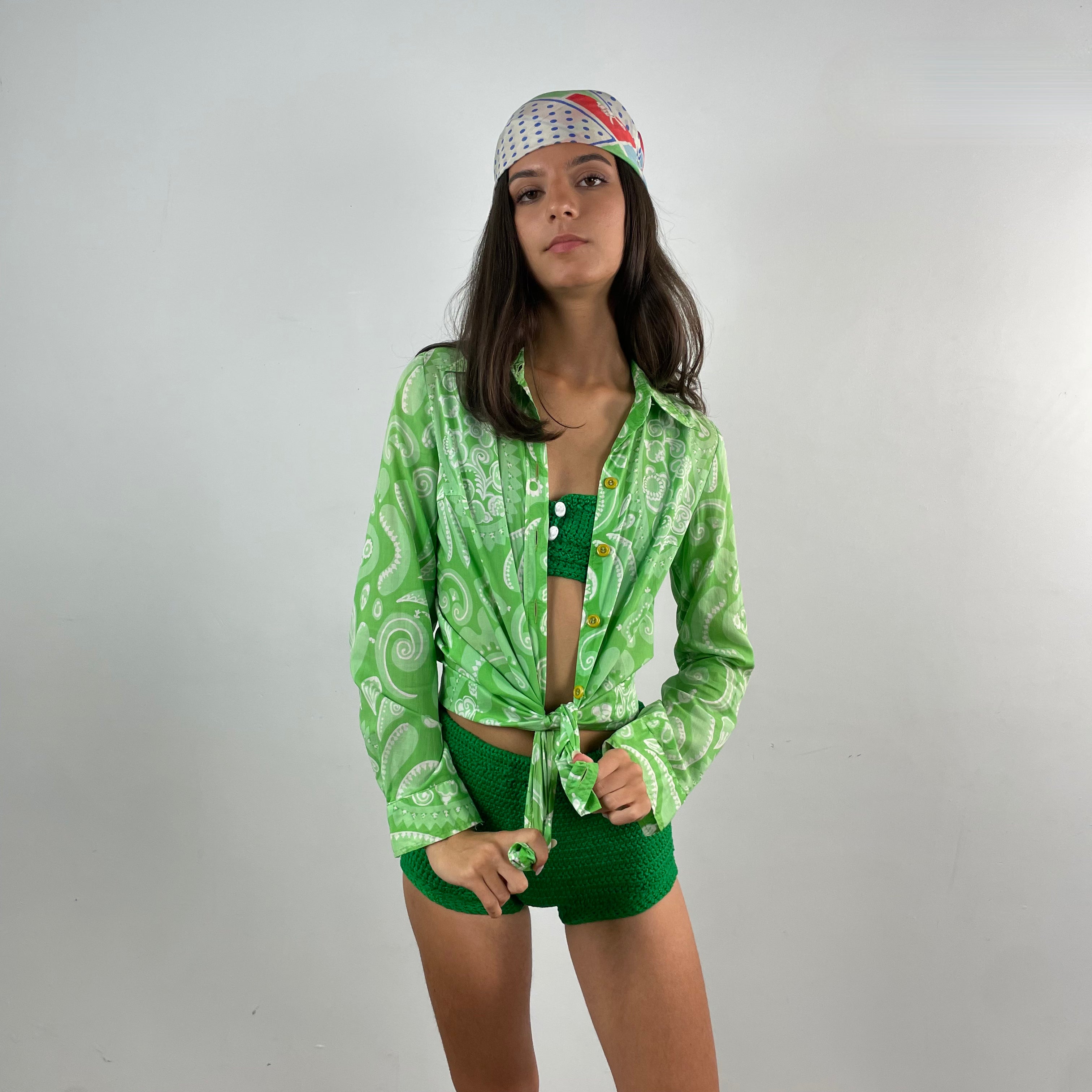 Front view of 1960s Hand-Knit Irish Green Two Piece Bathing Suit worn with a vintage 70s cotton blouse Size Extra Small sold at bohemevintage.com Montreal