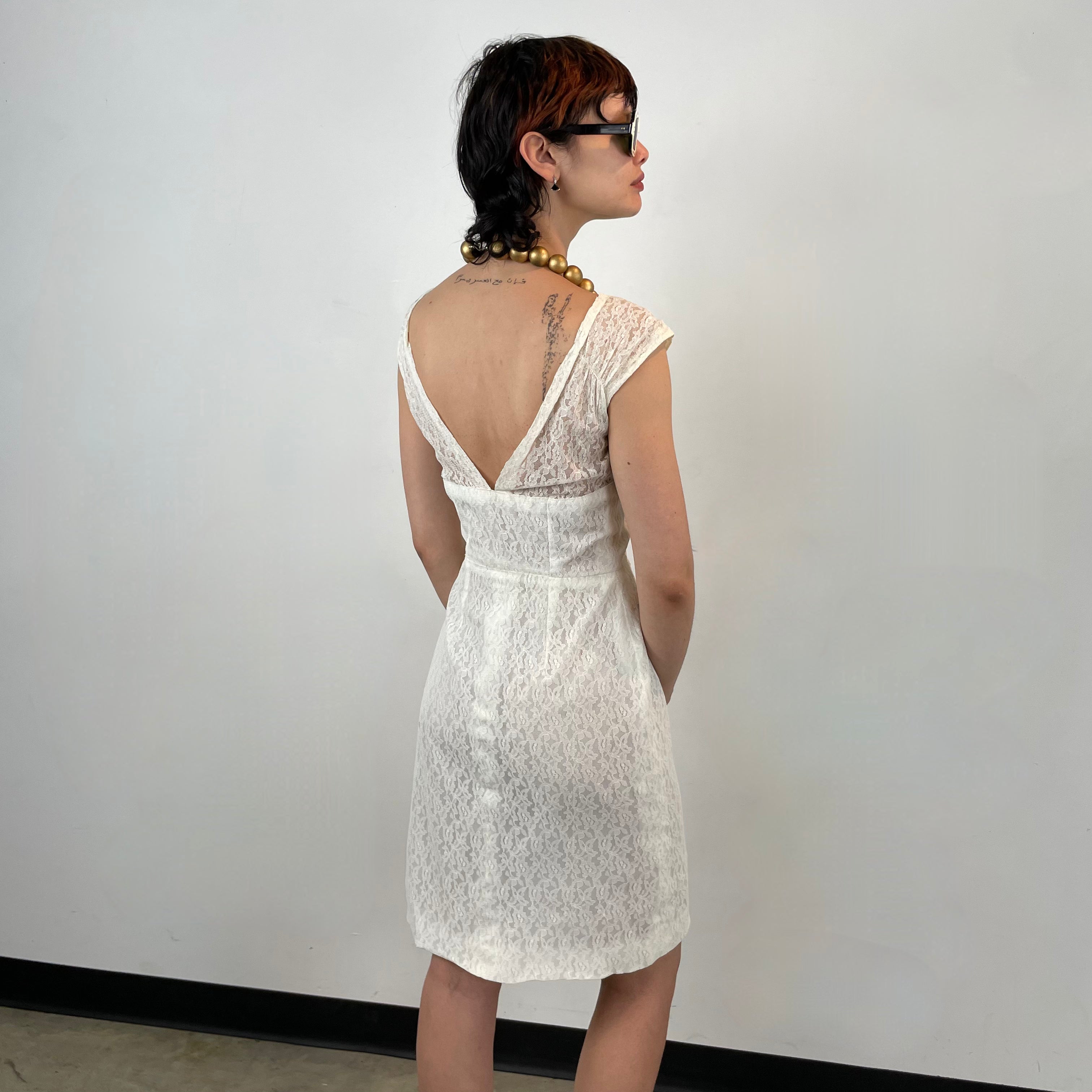 Back view of 1960s Ivory Lace Dress 
Size Small
Sold at bohemevintage.com 
Montréal 