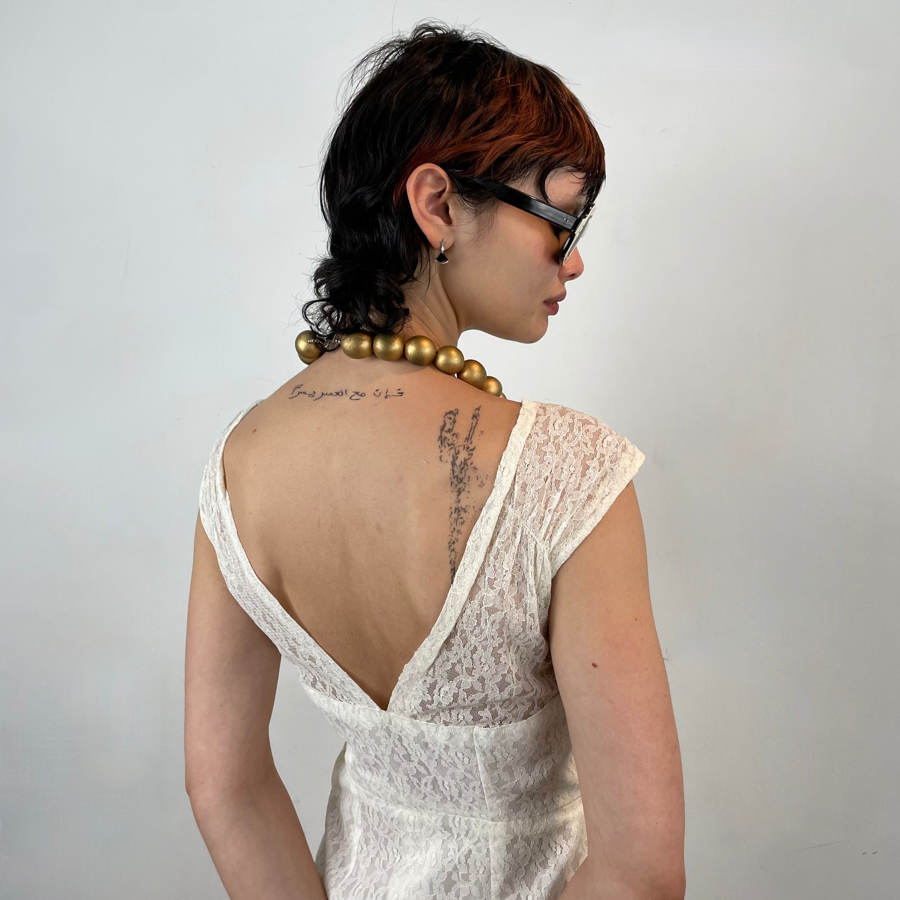 Close up back view of 1960s Ivory Lace Dress 
Size Small
Sold at bohemevintage.com 
Montréal 
