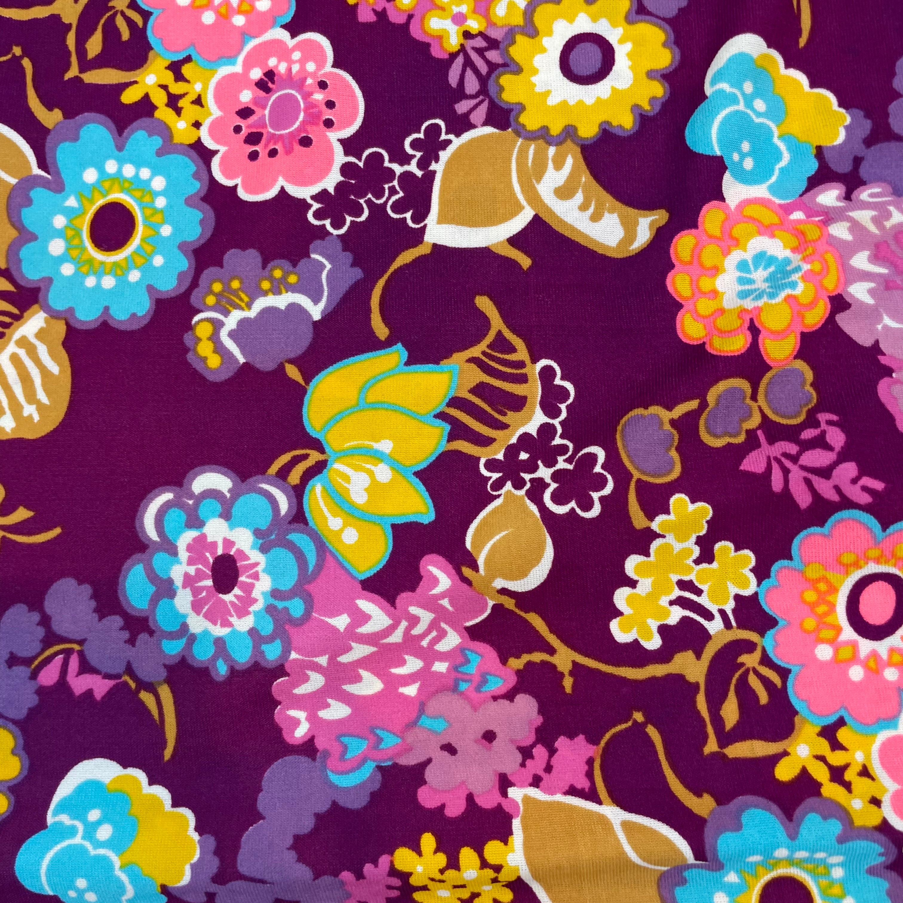 Close-up of print of 1970s floral empire waist maxi dress with ruched bodice, high neckline and long ruched sleeves in bold print lightweight fabric – Boheme Vintage Montreal https://bohemevintage.com