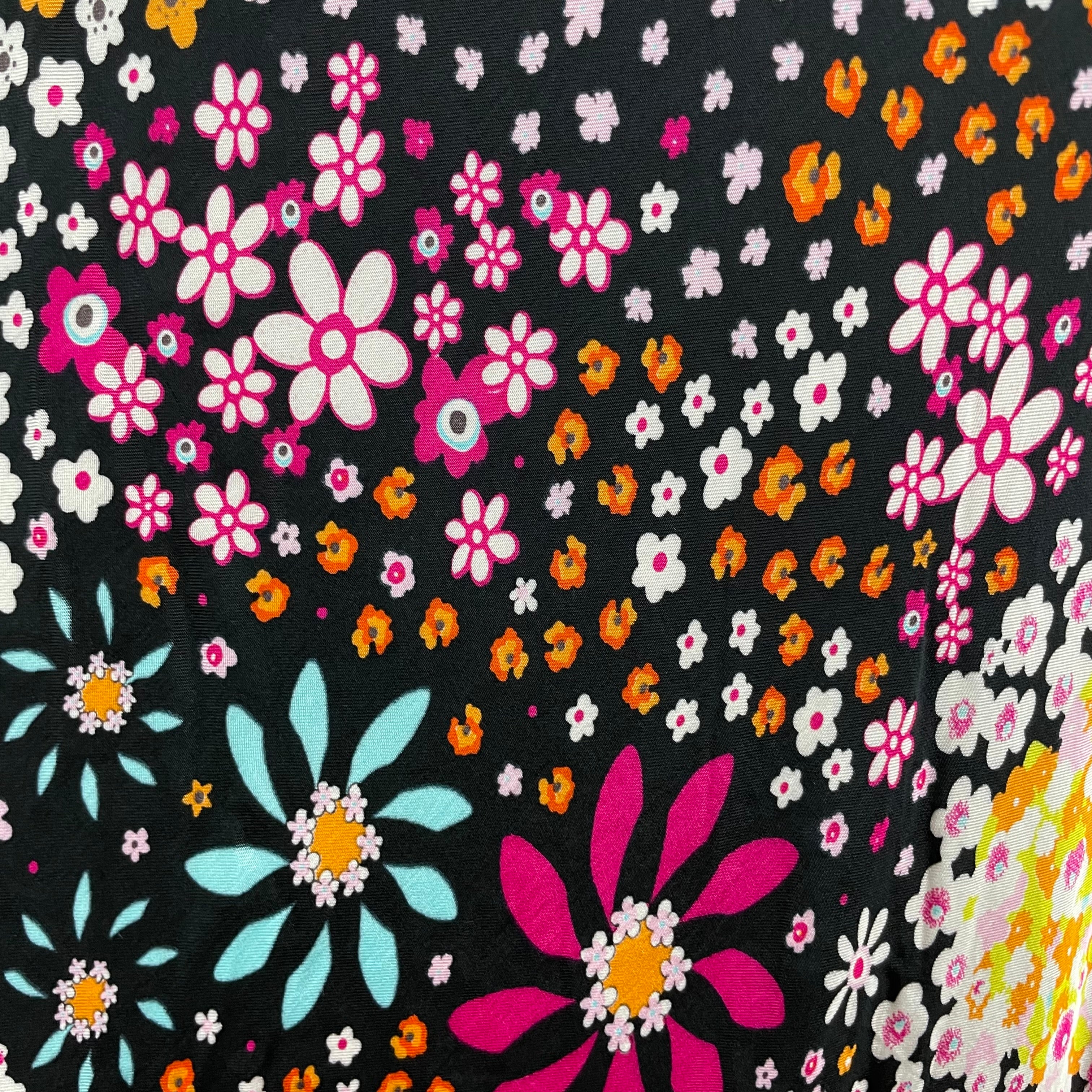 Vintage 1970s Ana Sanchez flared maxi skirt in dark colorful retro print, made from 100% viscose with an elastic waistband and knee-length lining.