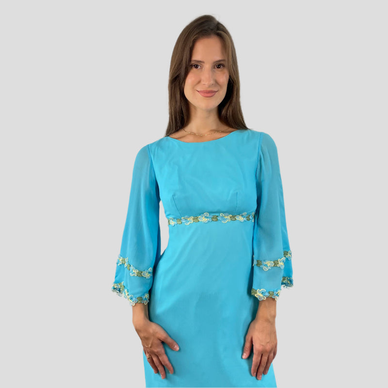 Front detail view of 1970s Turquoise Silk Chiffon Long-Sleeved Maxi Dress Small sold on bohemevintage.com Montreal