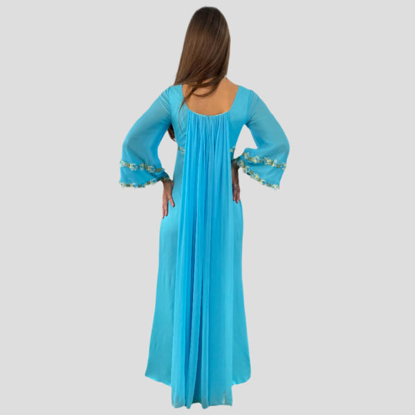 Back view of 1970s Turquoise Silk Chiffon Long-Sleeved Maxi Dress Small sold on bohemevintage.com Montreal