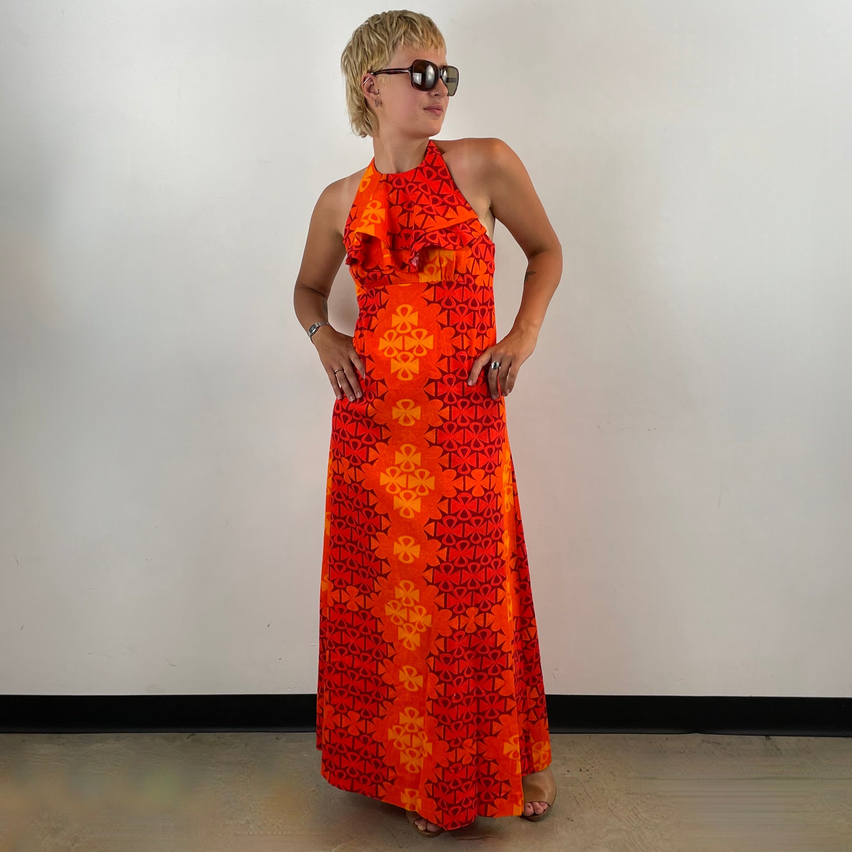 Boheme Vintage 1970s Paradise Isle Hawaiian cotton halter maxi dress with tropical print, empire waist, and flounced neckline.
