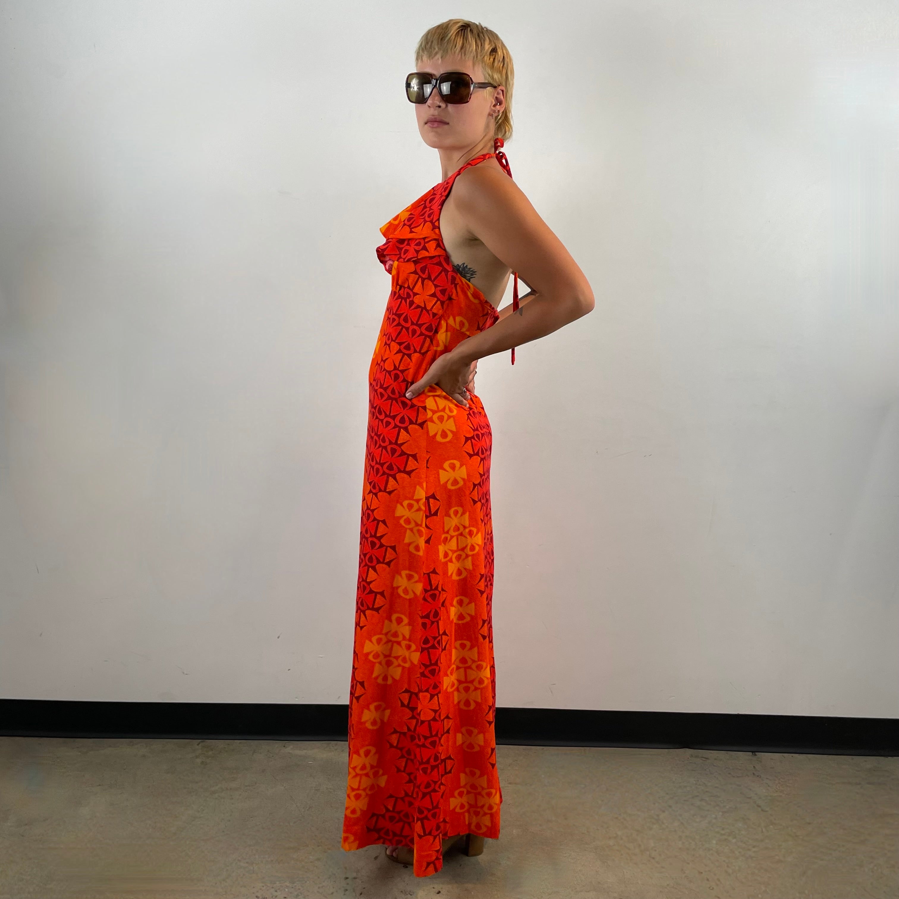 Boheme Vintage 1970s Paradise Isle Hawaiian cotton halter maxi dress with tropical print, empire waist, and flounced neckline.