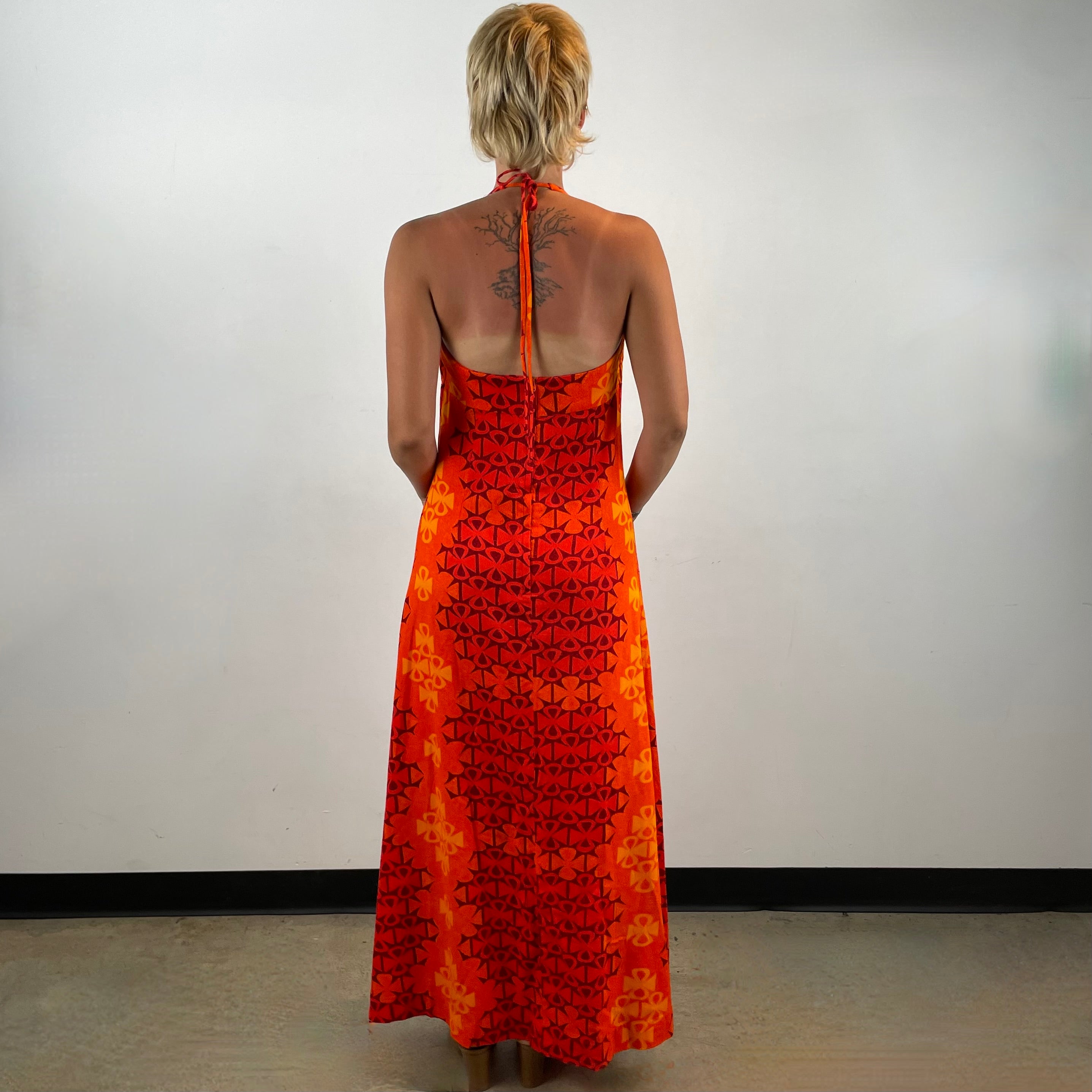 Boheme Vintage 1970s Paradise Isle Hawaiian cotton halter maxi dress with tropical print, empire waist, and flounced neckline.