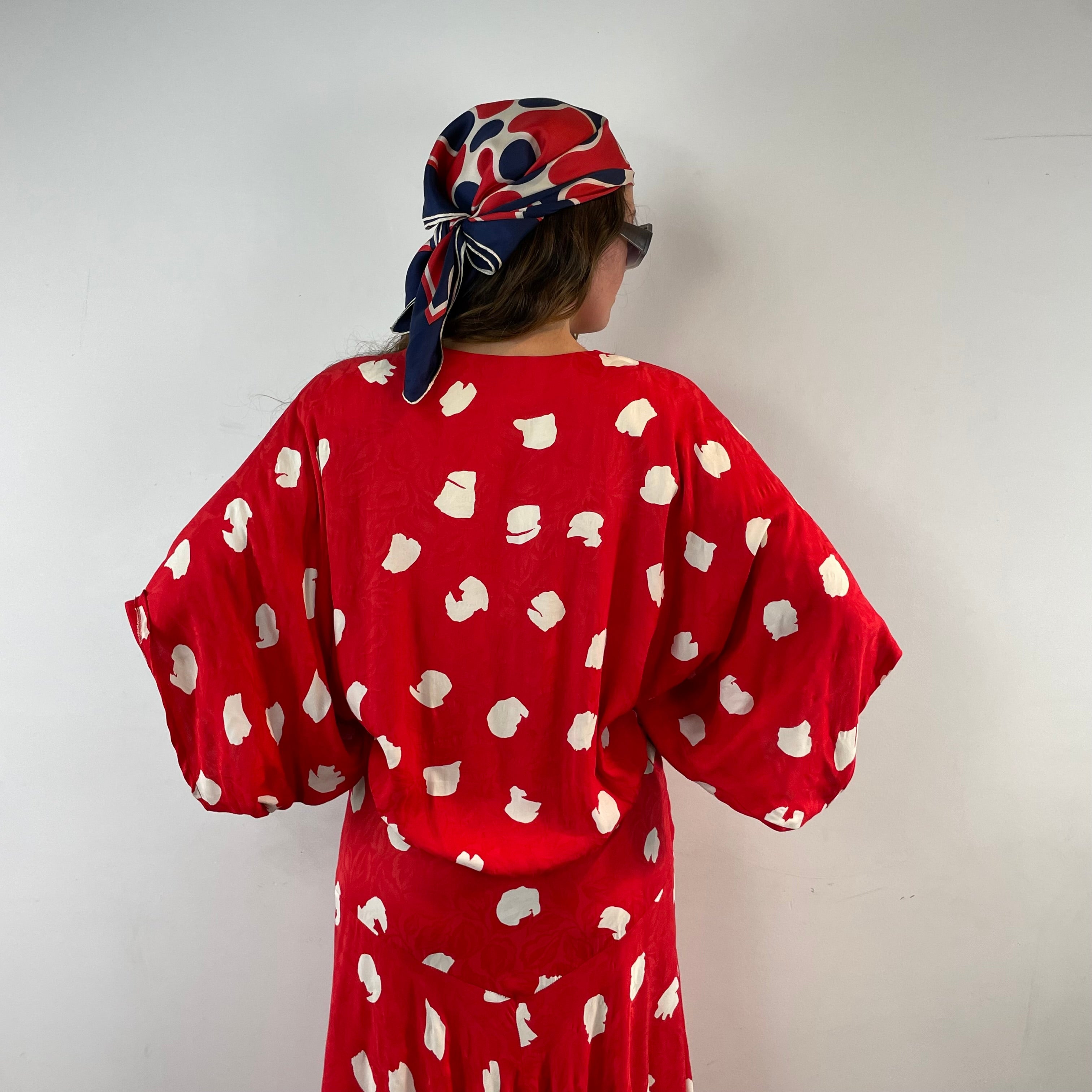 Boheme Vintage 1980s Jackie Bernard for EKLEKTIC red and white viscose kimono-style midi wrap dress with dolman sleeves and pleated skirt.