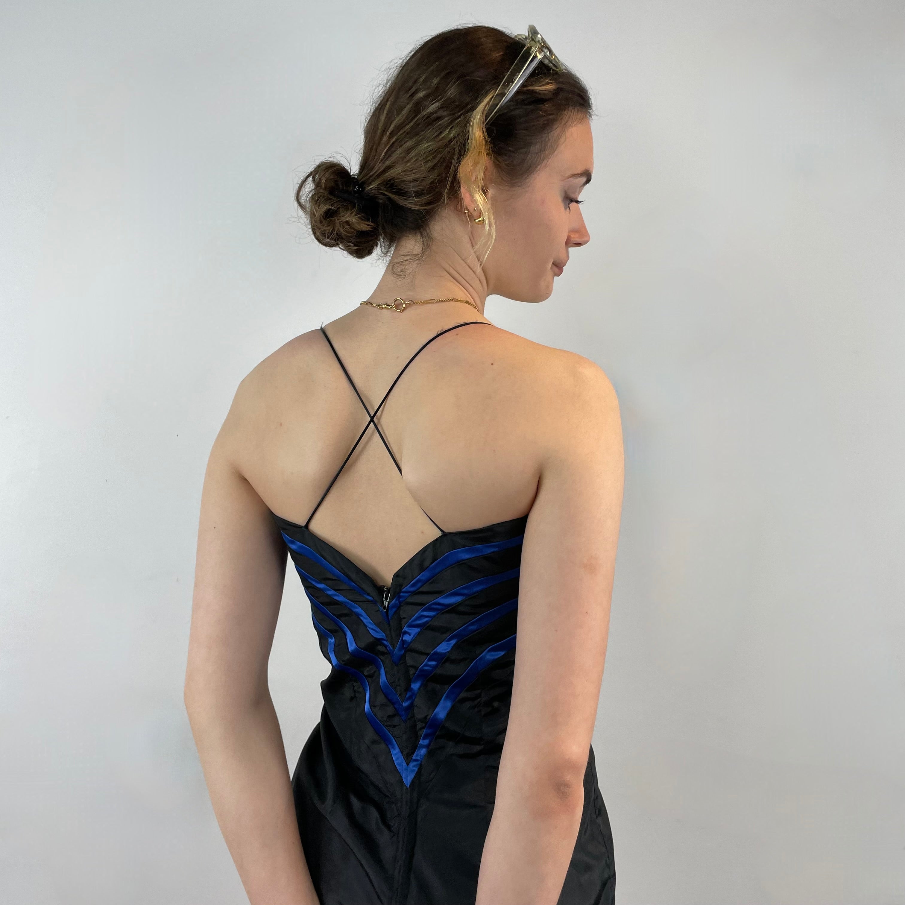 Boheme Vintage 1990s–2000s black satin bustier pencil dress with blue pleated detailing, spaghetti straps, and fitted silhouette.