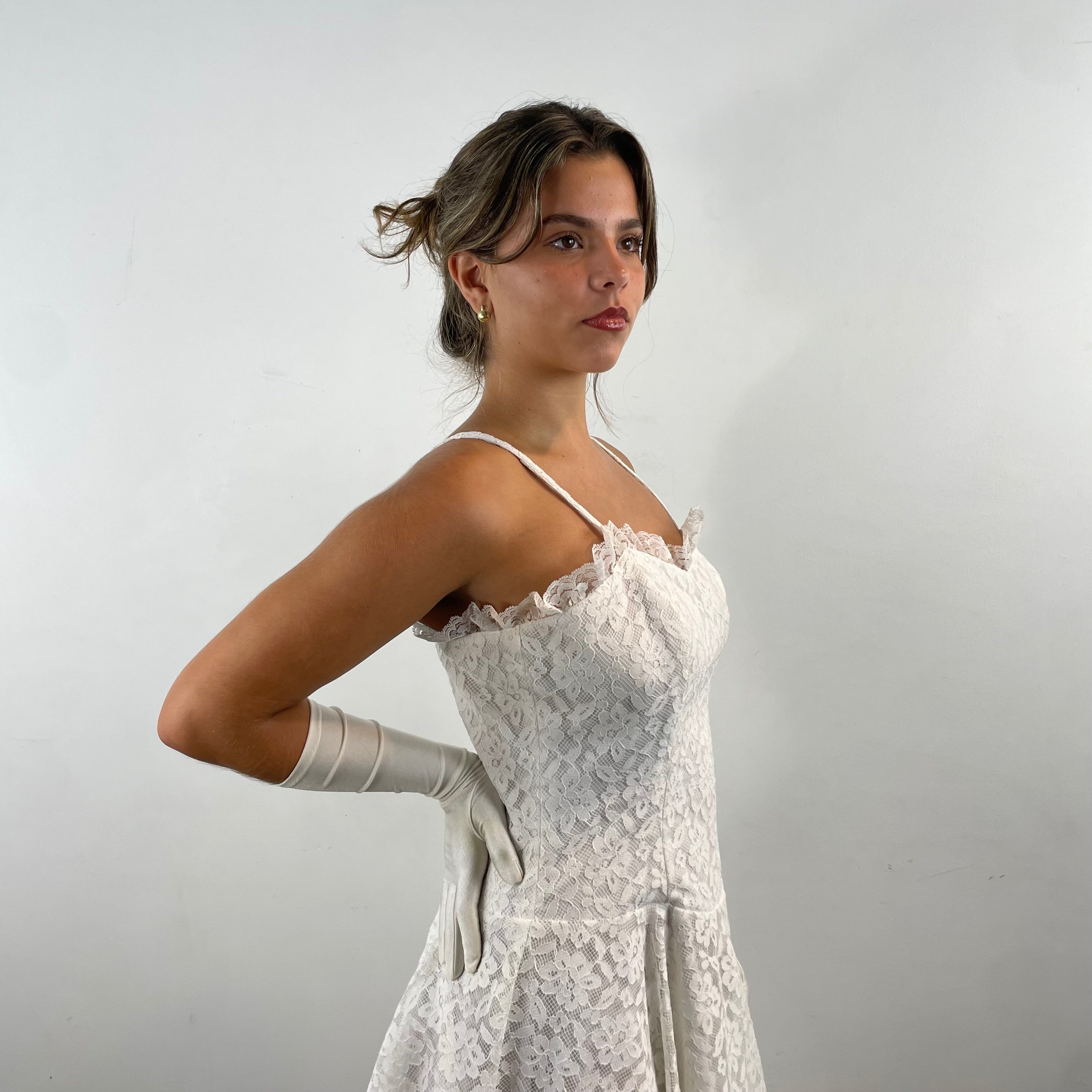 Boheme Vintage 1990s Algo Boutique white lace bustier dress with narrow straps, flared skirt, and layered tulle hem.