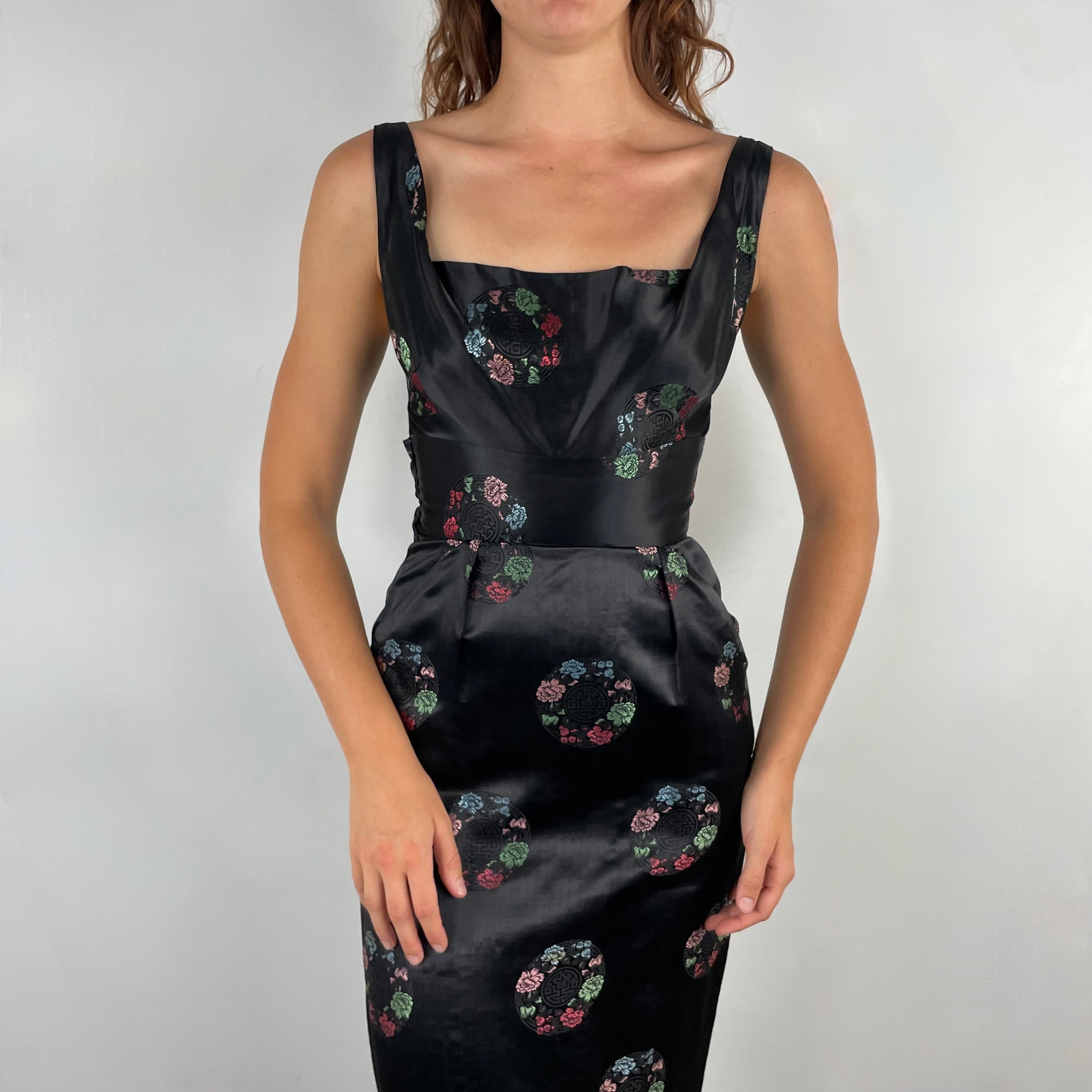 Close-up front view of 1960s Black Satin Brocade Midi Dress
Size Small
Sold at bohemevintage.com
Montréal