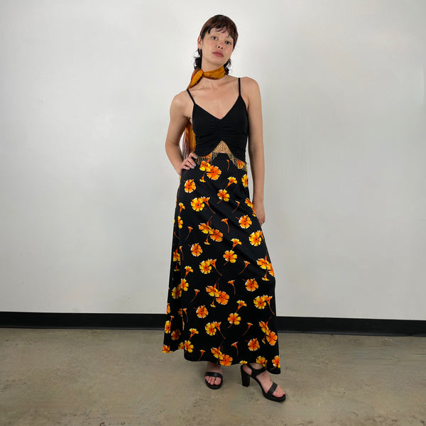 Front view of 1970s Black Floral Printed Maxi Skirt 
Size Extra Small/Small
Sold at bohemevintage.com 
Montréal 