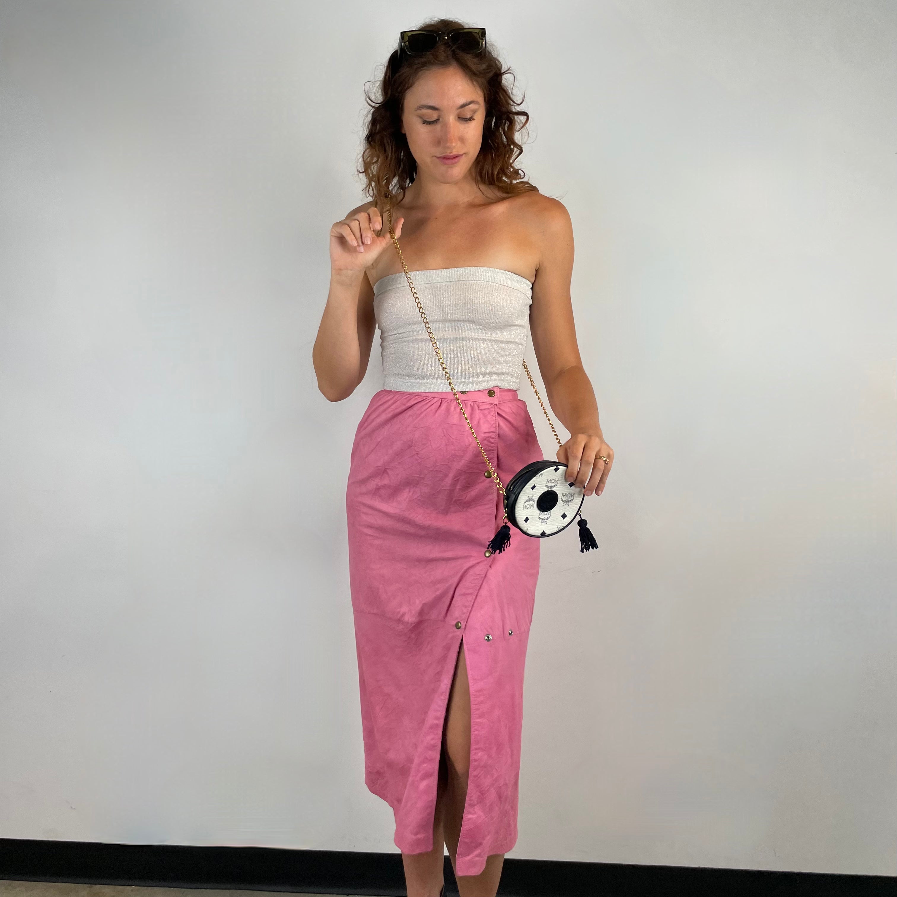 Front view of 1980s Robert Krief Designer Pink Leather Midi Skirt 
Size Small/Medium
Sold at bohemevintage.com 
Montréal 