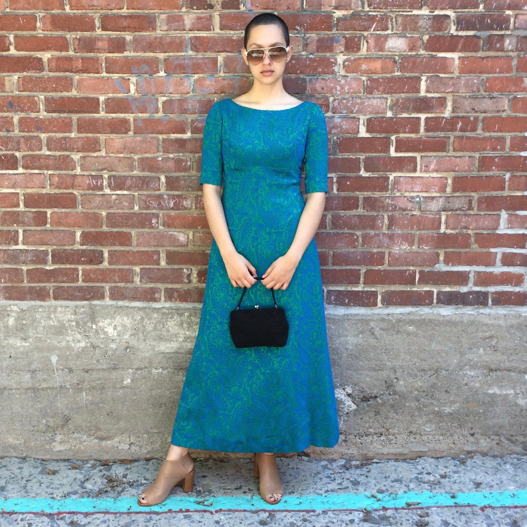 Vintage 1960s blue and green brocade ankle-length evening dress with empire waist and low back detail, photographed in Montreal for Boheme Vintage – https://bohemevintage.com
 – Montreal vintage fashion boutique.