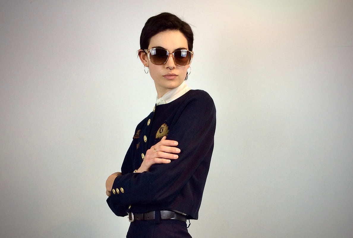 Model is wearing a 1980s cropped  navy blazer from Mondi with  1970s jabot collar blouse 