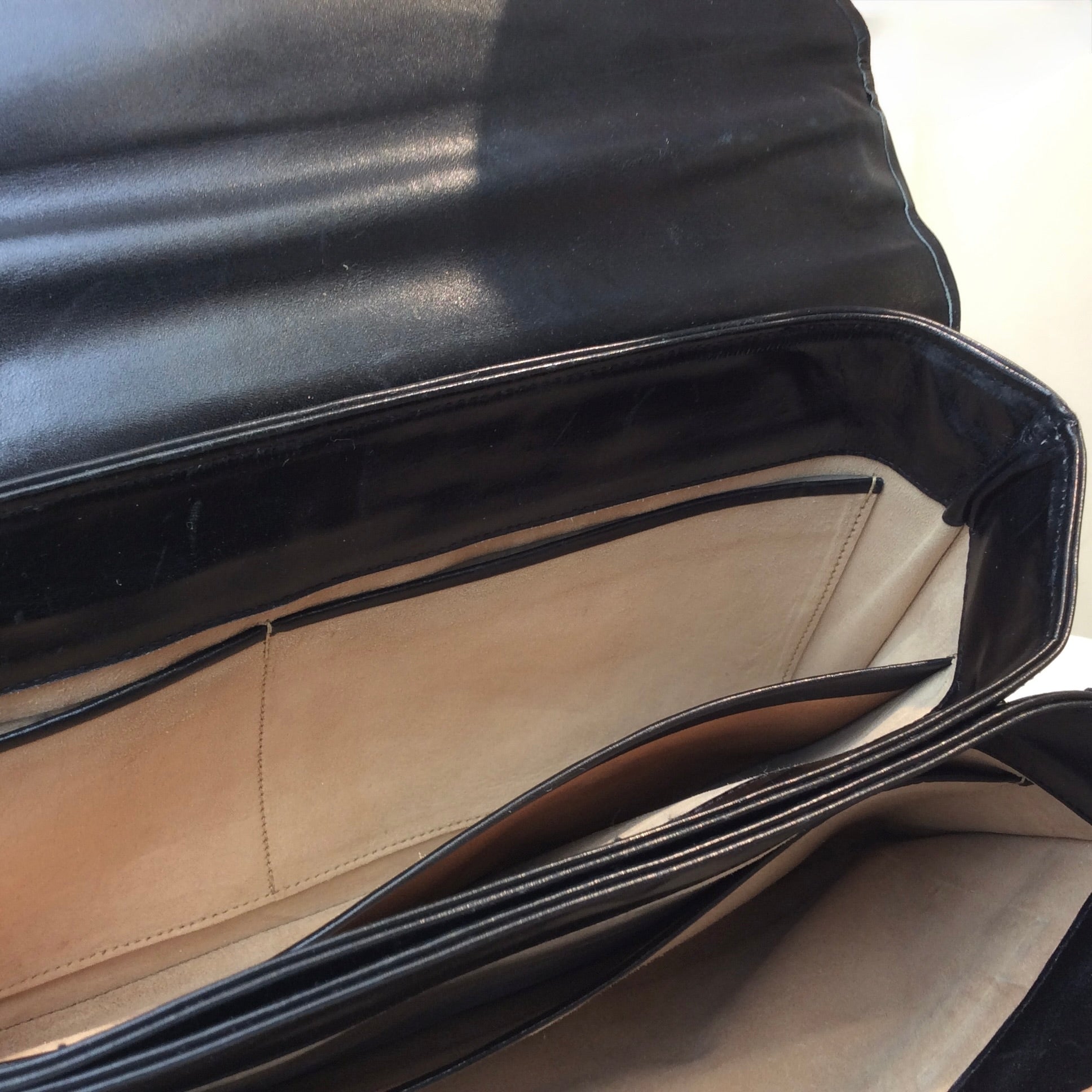 Vintage Art Deco leather handbag with unique closure and gold-tone hardware, available at Boheme Vintage, Montreal — bohemevintage.com