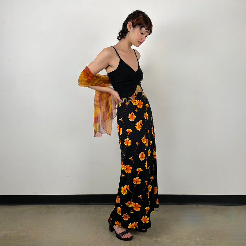 Side view of 1970s Black Floral Printed Maxi Skirt 
Size Extra Small/Small
Sold at bohemevintage.com 
Montréal 