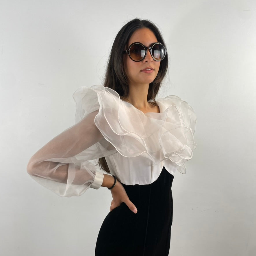 Side view of 1980s Ruffle Collar Stirrup Jumpsuit
Size Small
Sold at bohemevintage.com Montréal 