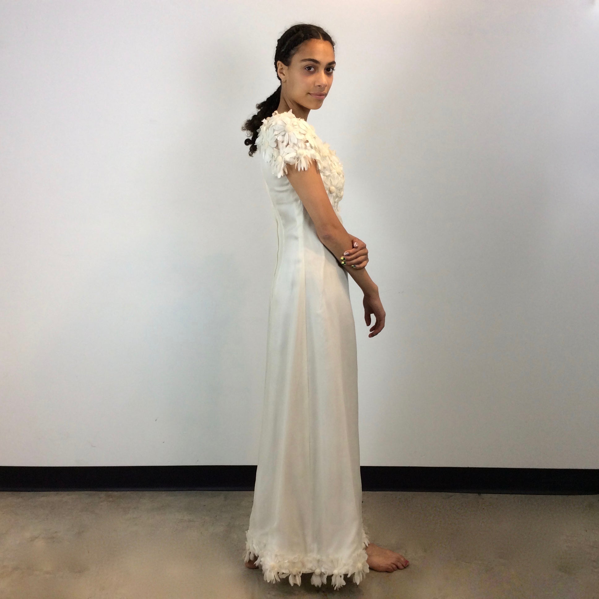 Side view of 1970s Daisy Embellished Ivory Organza Maxi Dress 
Size Small
Sold at bohemevintage.com
Montréal
