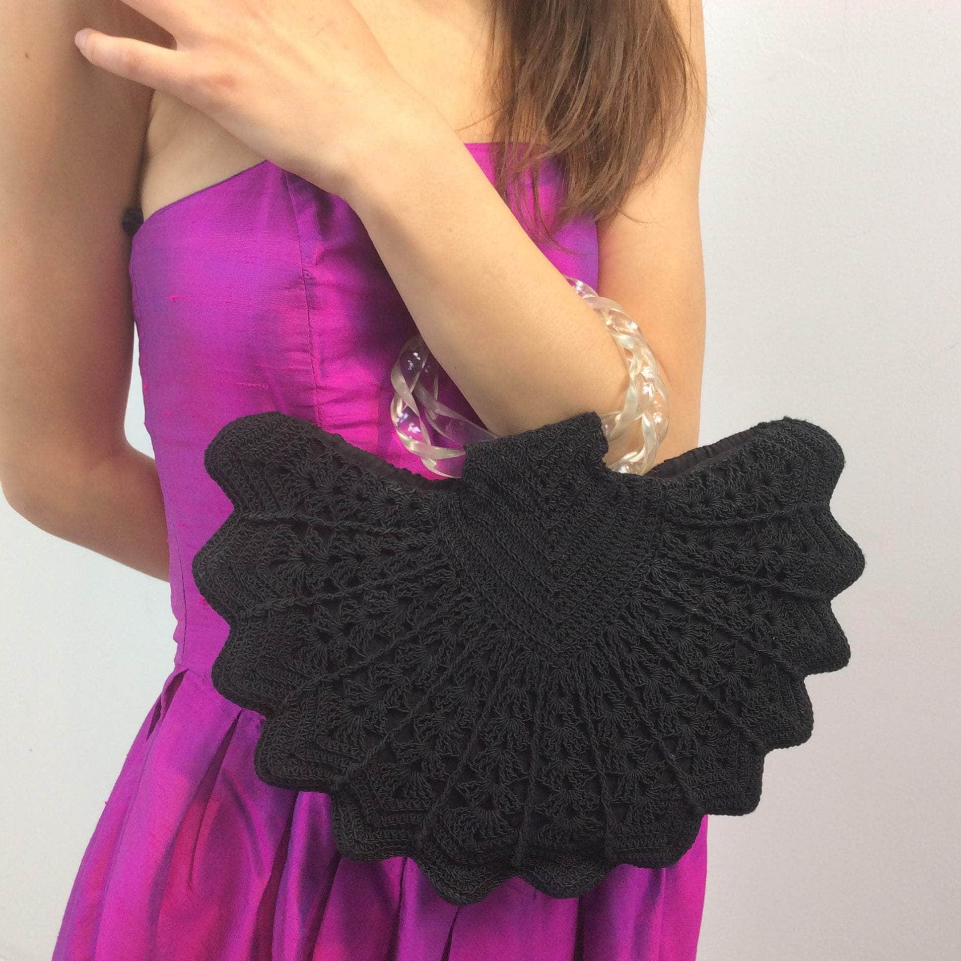 Boheme Vintage 1940s black crochet peacock‑shape evening handbag with clear twisted lucite handles and zipper closure.