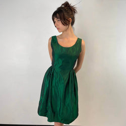 Front view of  1950s Green Metallic Petite Dress Size small to extra small sold at bohemevintage.com Montreal