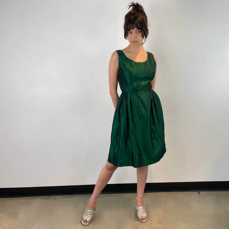Front view of 1950s Green Metallic Petite Dress Size small to extra small sold at bohemevintage.com Montreal