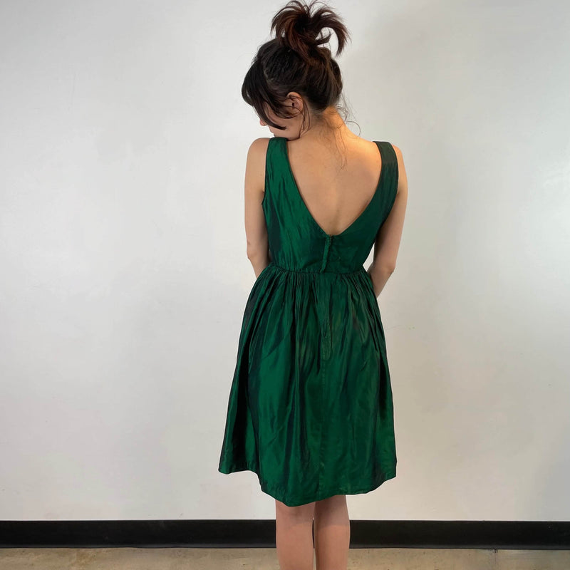 Back view of 1950s Green Metallic Petite Dress Size small to extra small sold at bohemevintage.com Montreal