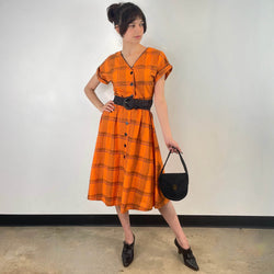 Front view of 1950s Orange Short Sleeve Buttoned-up Cotton Dress Size Small sold at bohemevintage.com Montreal