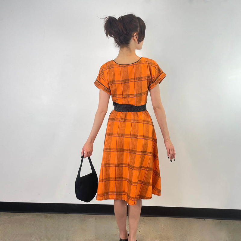 Back view of 1950s Orange Short Sleeve Buttoned-up Cotton Dress Size Small sold at bohemevintage.com Montreal