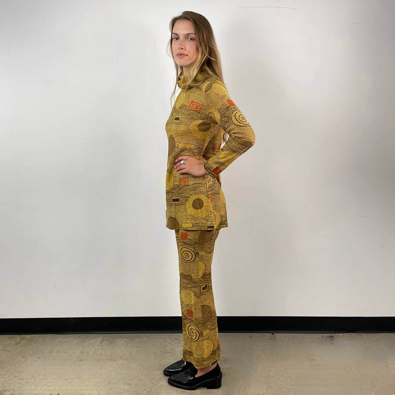 Side view of 1960s/70s Gold Patterned Mini Dress and Pant Set Size small sold at bohemevintage.com Montreal