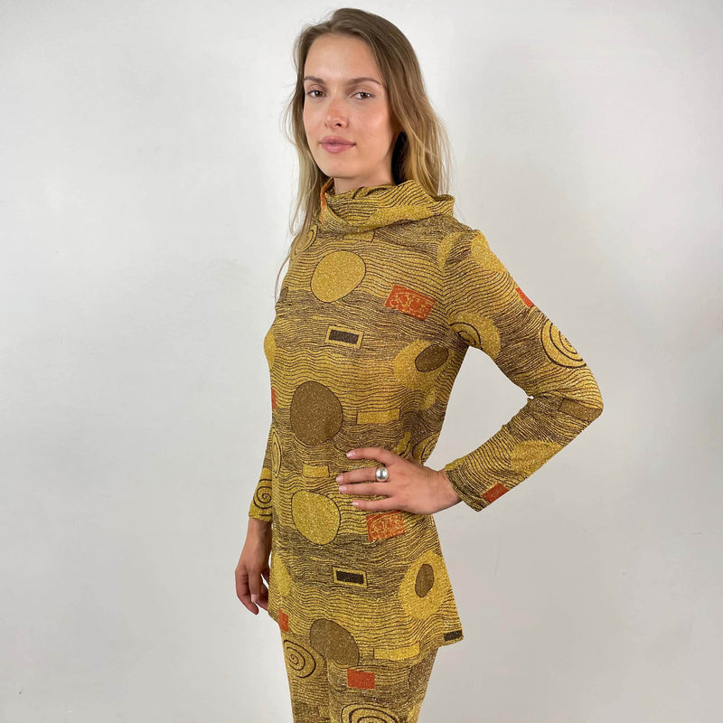Close-up view of 1960s/70s Gold Patterned Mini Dress and Pant Set Size small sold at bohemevintage.com Montreal