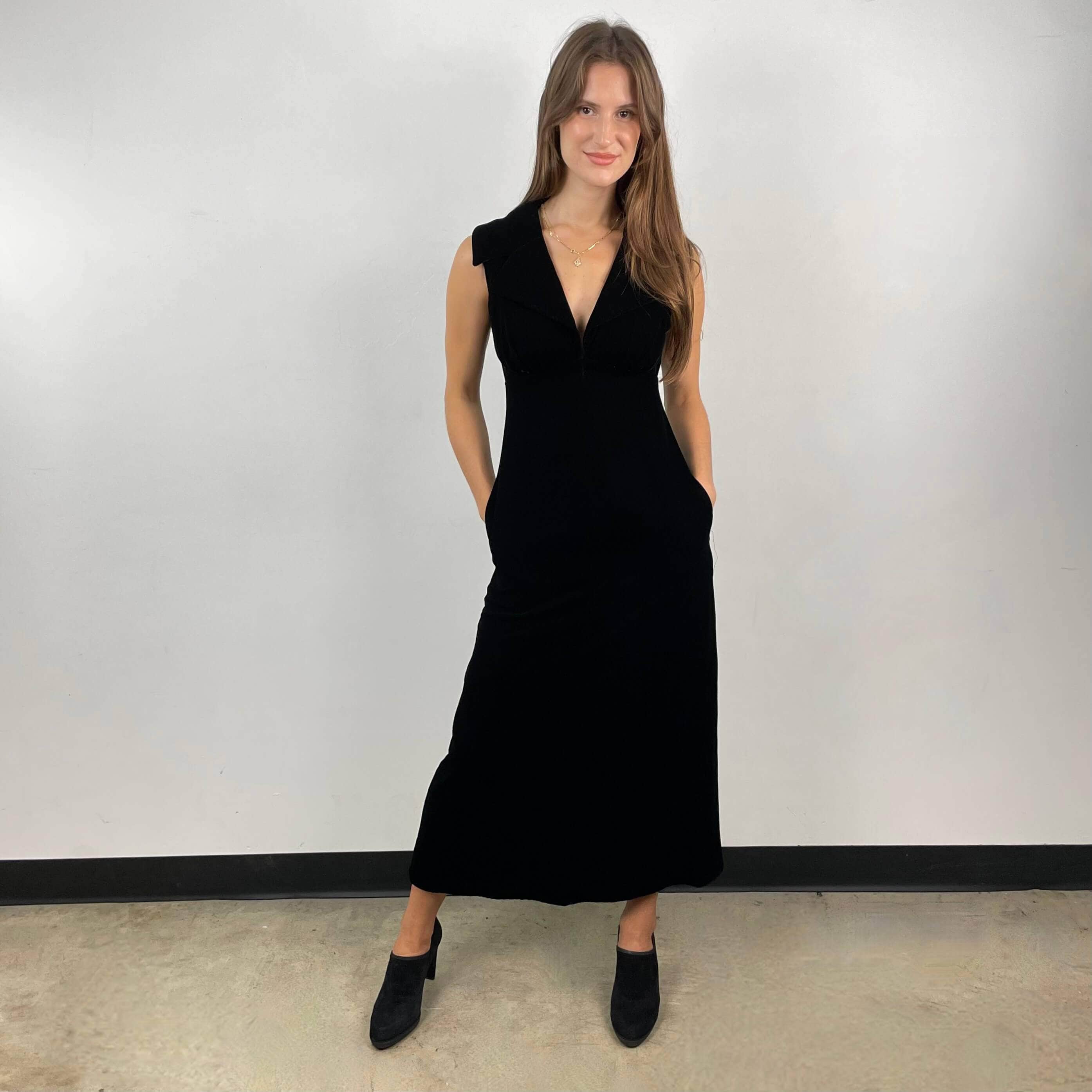 Front view of 1970s Deep V-Neck Black Velvet Midi Dress Size Small  sold on bohemevintage.com Montreal  