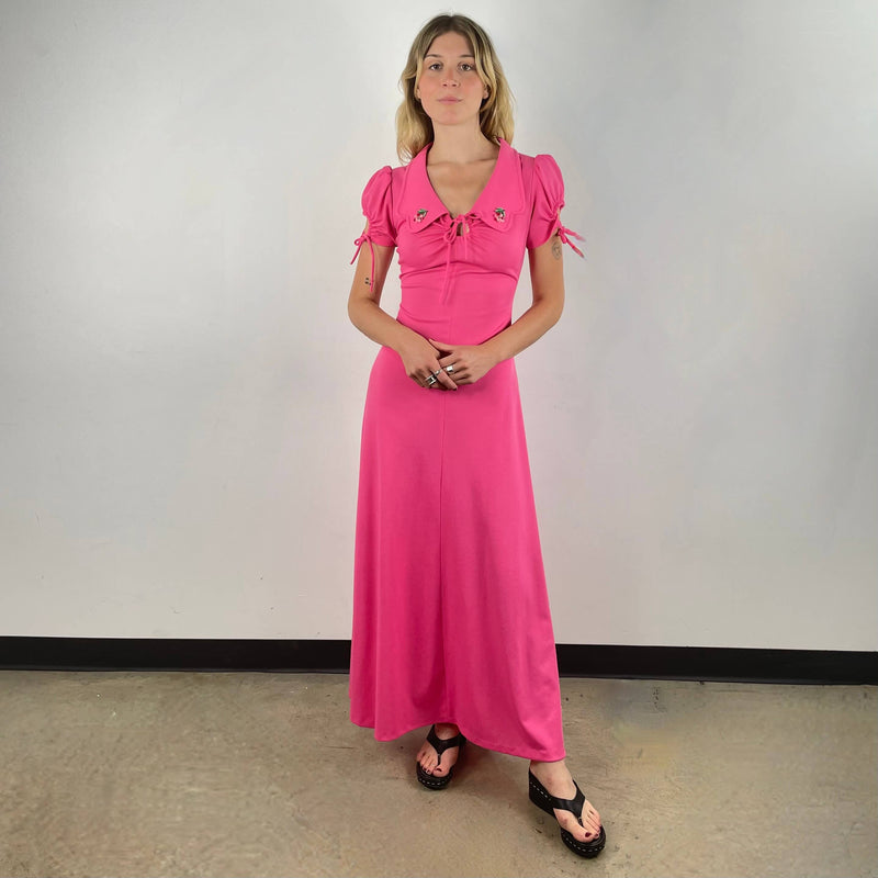 Front View of 1970s Short Sleeve Flared Pink Maxi Dress Size Small sold At bohemevintage.com Montreal