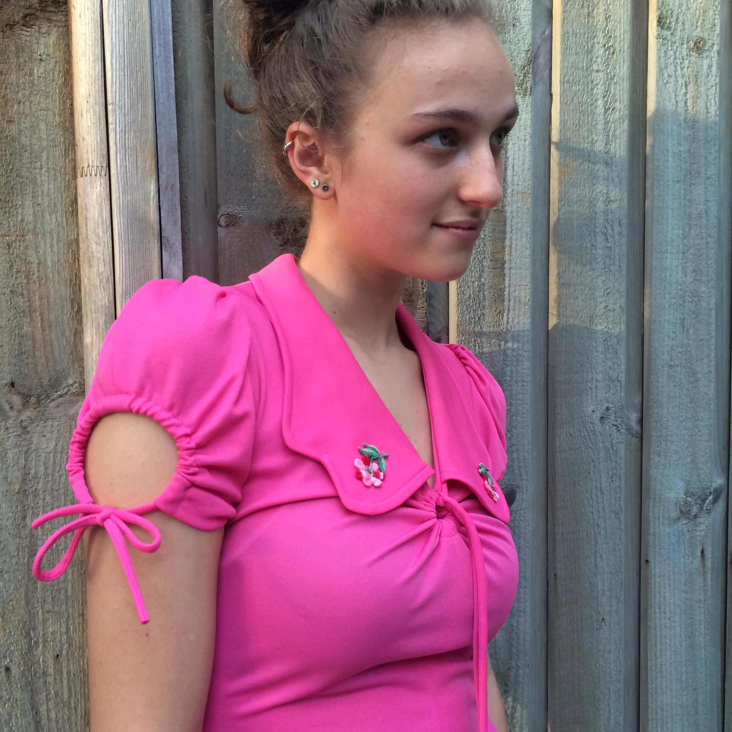 Upper Side View of Front View of 1970s Short Sleeve Flared Pink Maxi Dress Size Small sold At bohemevintage.com Montreal